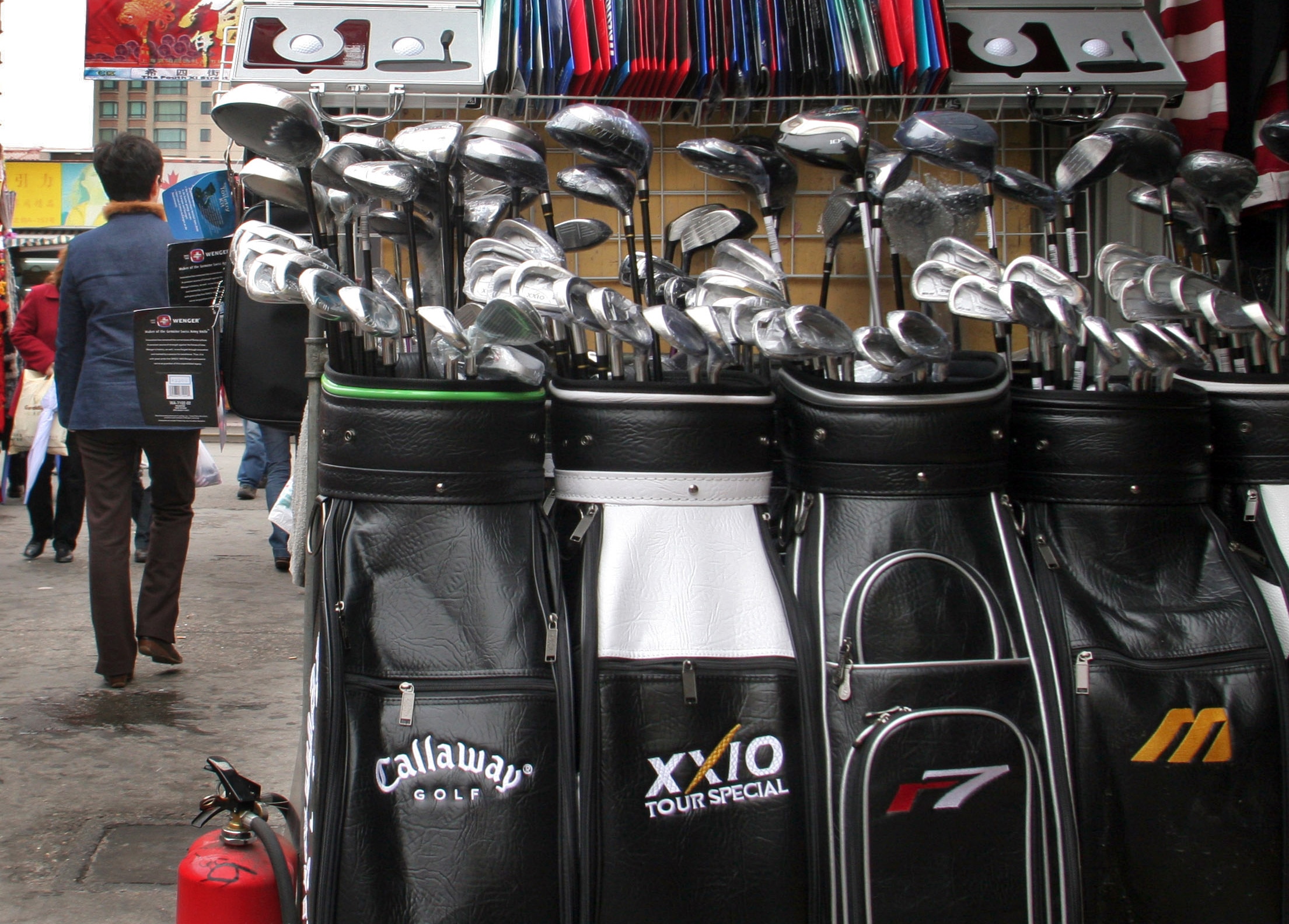 CHINA - MARCH 21:  Bags of counterfeit golf clubs, including those branded with the Callaway Golf Co. label, are on display for sale at a stall in Shanghai's Shenyang Market March 21, 2005.  (Photo by Kevin Lee/Bloomberg via Getty Images)