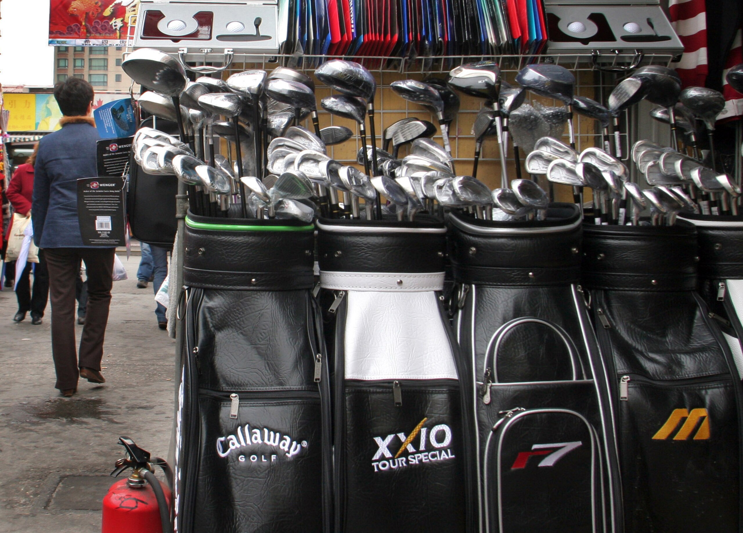 CHINA - MARCH 21:  Bags of counterfeit golf clubs, including those branded with the Callaway Golf Co. label, are on display for sale at a stall in Shanghai's Shenyang Market March 21, 2005.  (Photo by Kevin Lee/Bloomberg via Getty Images)