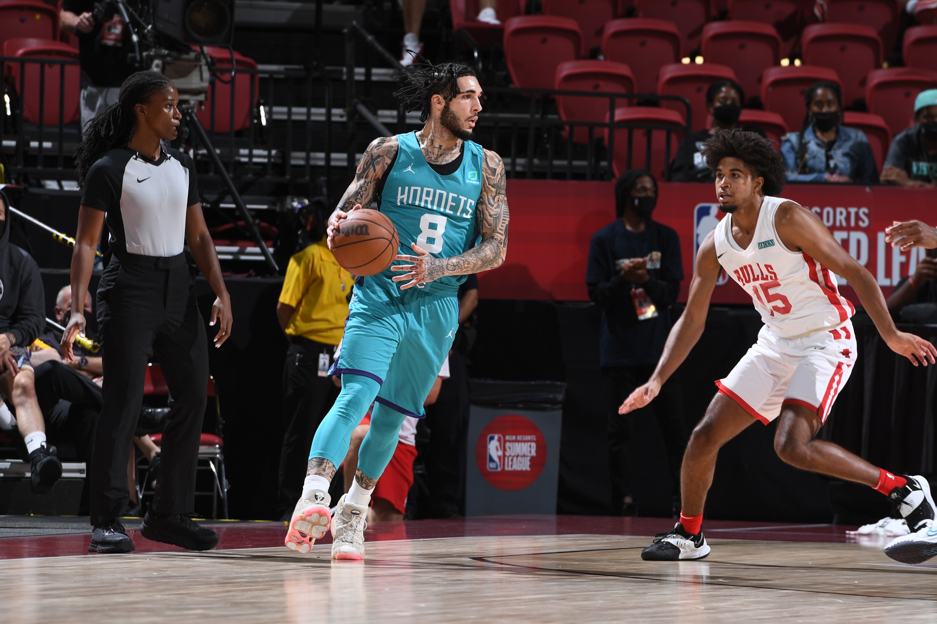 LAS VEGAS, NV - AUGUST 16:  LiAngelo Ball #8 of Charlotte Hornets handles the ball against the Chicago Bulls during the 2021 Las Vegas Summer League on August 16, 2021 at the Thomas & Mack Center in Las Vegas, Nevada. NOTE TO USER: User expressly acknowledges and agrees that, by downloading and or using this Photograph, User is consenting to the terms and conditions of the Getty Images License Agreement. Mandatory Copyright Notice: Copyright 2021 NBAE (Photo by Garrett Ellwood/NBAE via Getty Images)