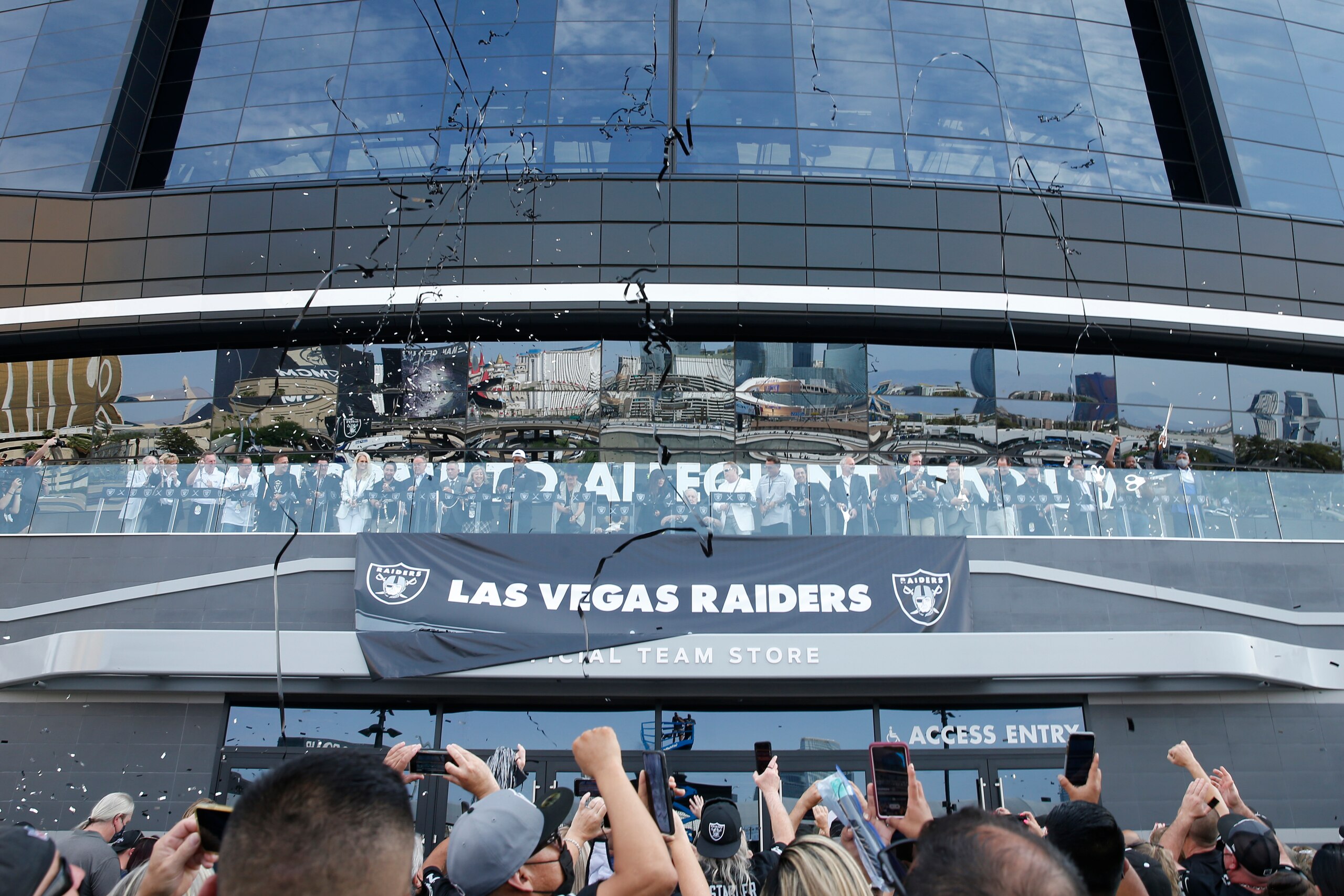 People cheer during a ribbon cutting at Allegiant Stadium before an NFL preseason football game between the Las Vegas Raiders and the Seattle Seahawks, Saturday, Aug. 14, 2021, in Las Vegas. (AP Photo/Steve Marcus) People cheer during a ribbon cutting at Allegiant Stadium before an NFL preseason football game between the Las Vegas Raiders and the Seattle Seahawks, Saturday, Aug. 14, 2021, in Las Vegas. (AP Photo/Steve Marcus)