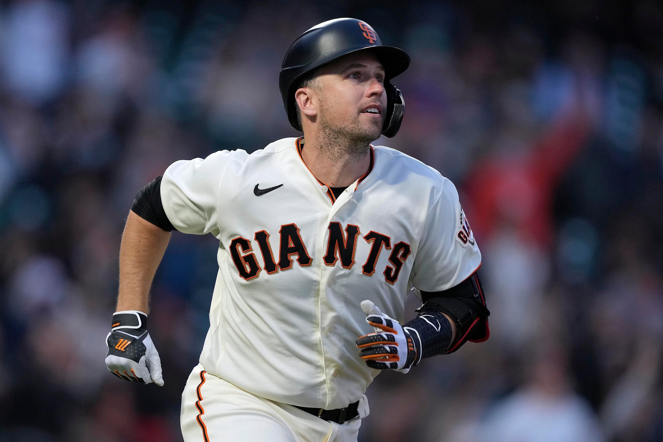 San Francisco Giants' Buster Posey watches his solo home run during the third inning of the team's baseball game against the Arizona Diamondbacks on Wednesday, Aug. 11, 2021, in San Francisco. (AP Photo/Tony Avelar)