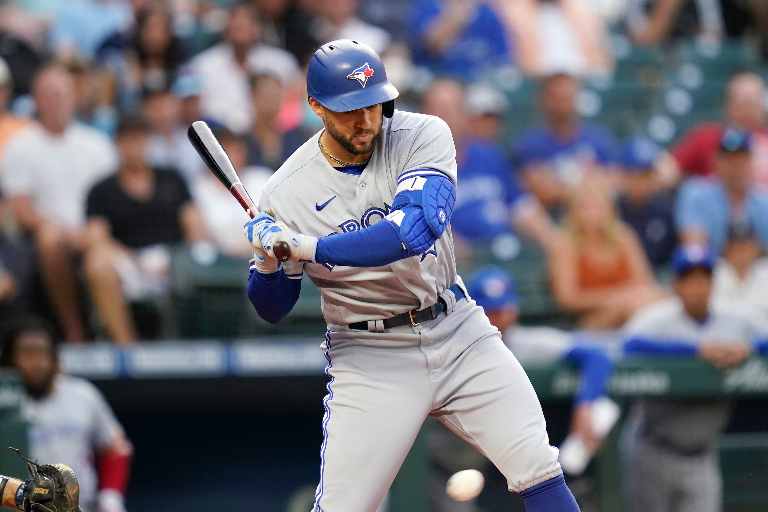 Toronto Blue Jays' George Springer watches a called third strike go past to end the top of the second inning of the team's baseball game against the Seattle Mariners on Saturday, Aug. 14, 2021, in Seattle. (AP Photo/Elaine Thompson)