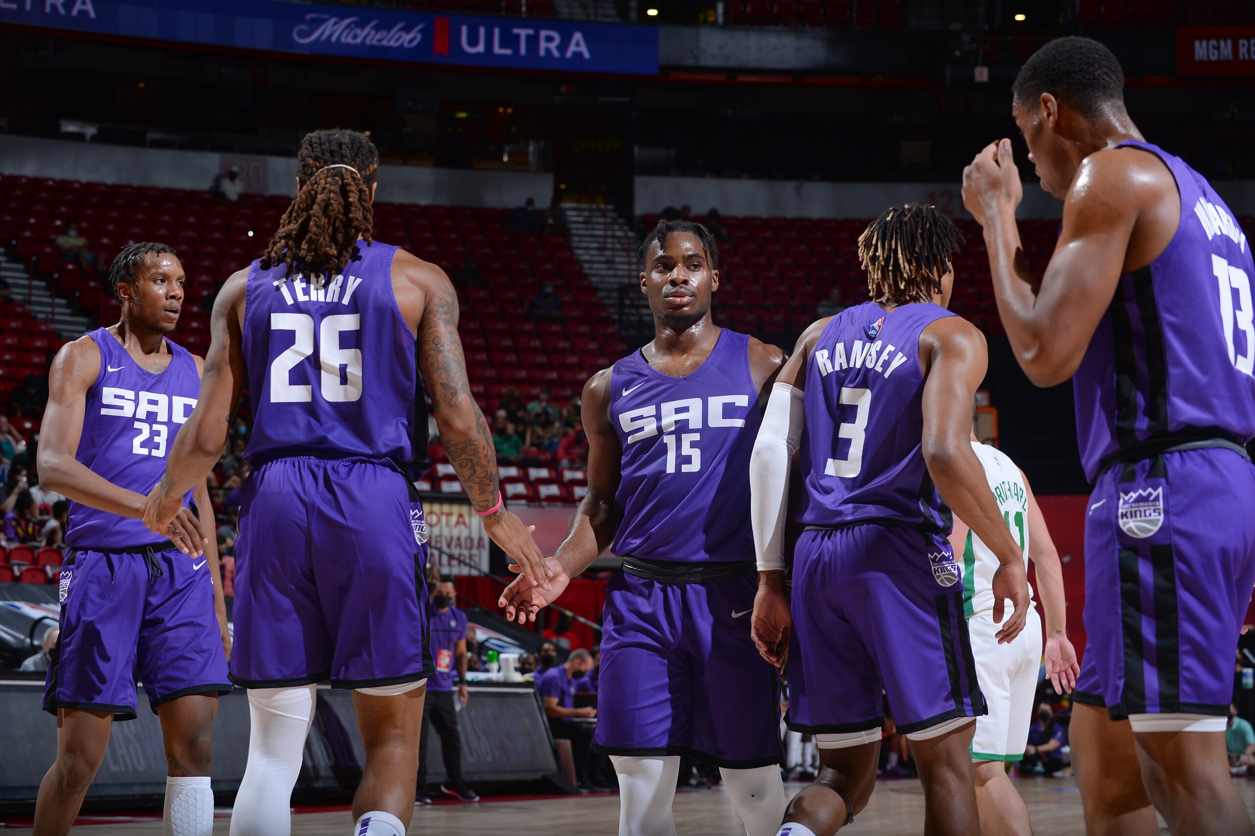 LAS VEGAS, NV - AUGUST 17:  Davion Mitchell #15 of the Sacramento Kings high fives teammates during the game against the Boston Celtics during the 2021 Las Vegas Summer League Championship Game on August 17, 2021 at the Thomas & Mack Center in Las Vegas, Nevada. NOTE TO USER: User expressly acknowledges and agrees that, by downloading and or using this Photograph, User is consenting to the terms and conditions of the Getty Images License Agreement. Mandatory Copyright Notice: Copyright 2021 NBAE (Photo by Bart Young/NBAE via Getty Images)