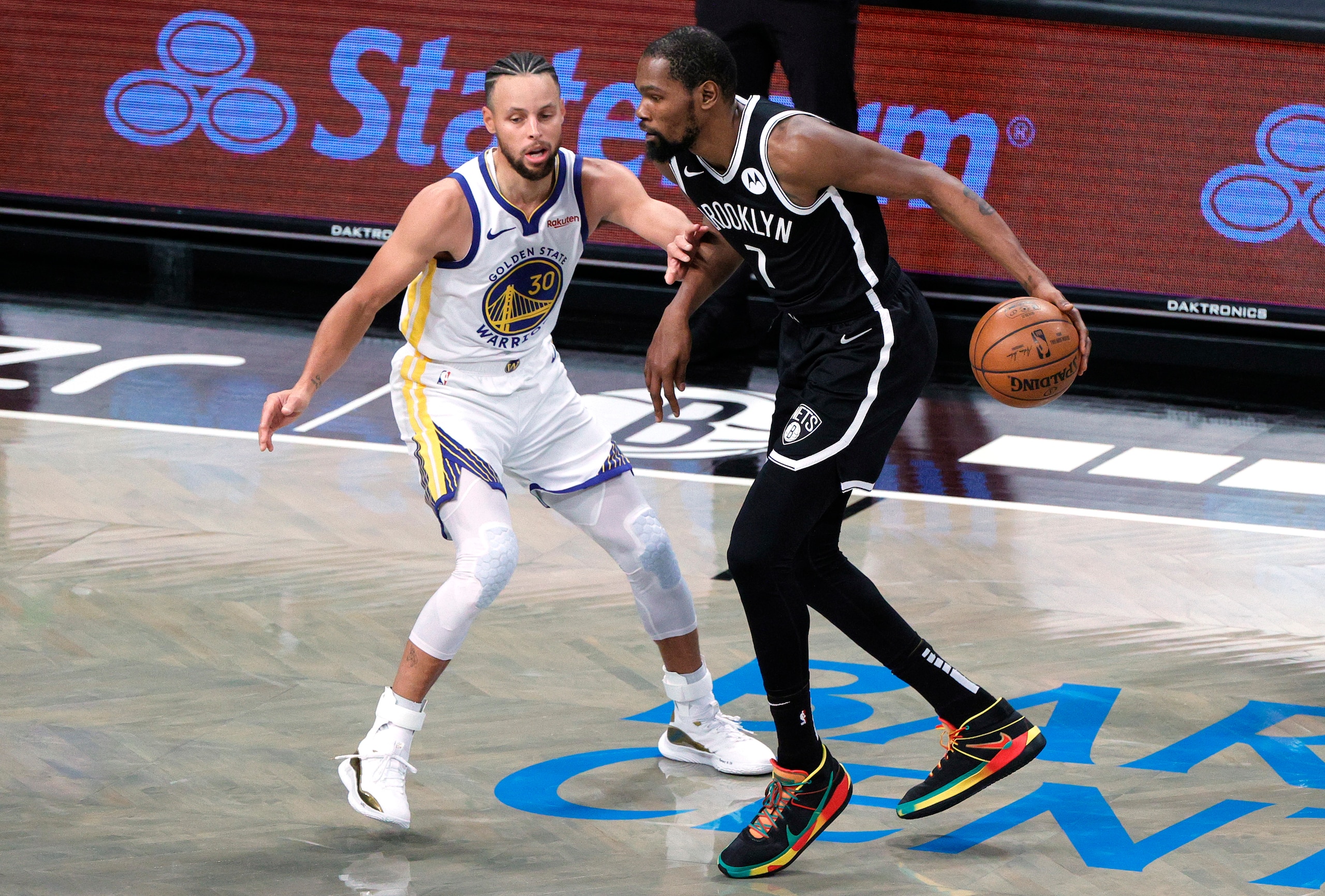 NEW YORK, NEW YORK - DECEMBER 22: Kevin Durant #7 of the Brooklyn Nets dribbles against Stephen Curry #30 of the Golden State Warriors during the first half at Barclays Center on December 22, 2020 in the Brooklyn borough of New York City. NOTE TO USER: User expressly acknowledges and agrees that, by downloading and/or using this photograph, user is consenting to the terms and conditions of the Getty Images License Agreement. (Photo by Sarah Stier/Getty Images) NEW YORK, NEW YORK - DECEMBER 22: Kevin Durant #7 of the Brooklyn Nets dribbles against Stephen Curry #30 of the Golden State Warriors during the first half at Barclays Center on December 22, 2020 in the Brooklyn borough of New York City. NOTE TO USER: User expressly acknowledges and agrees that, by downloading and/or using this photograph, user is consenting to the terms and conditions of the Getty Images License Agreement. (Photo by Sarah Stier/Getty Images)