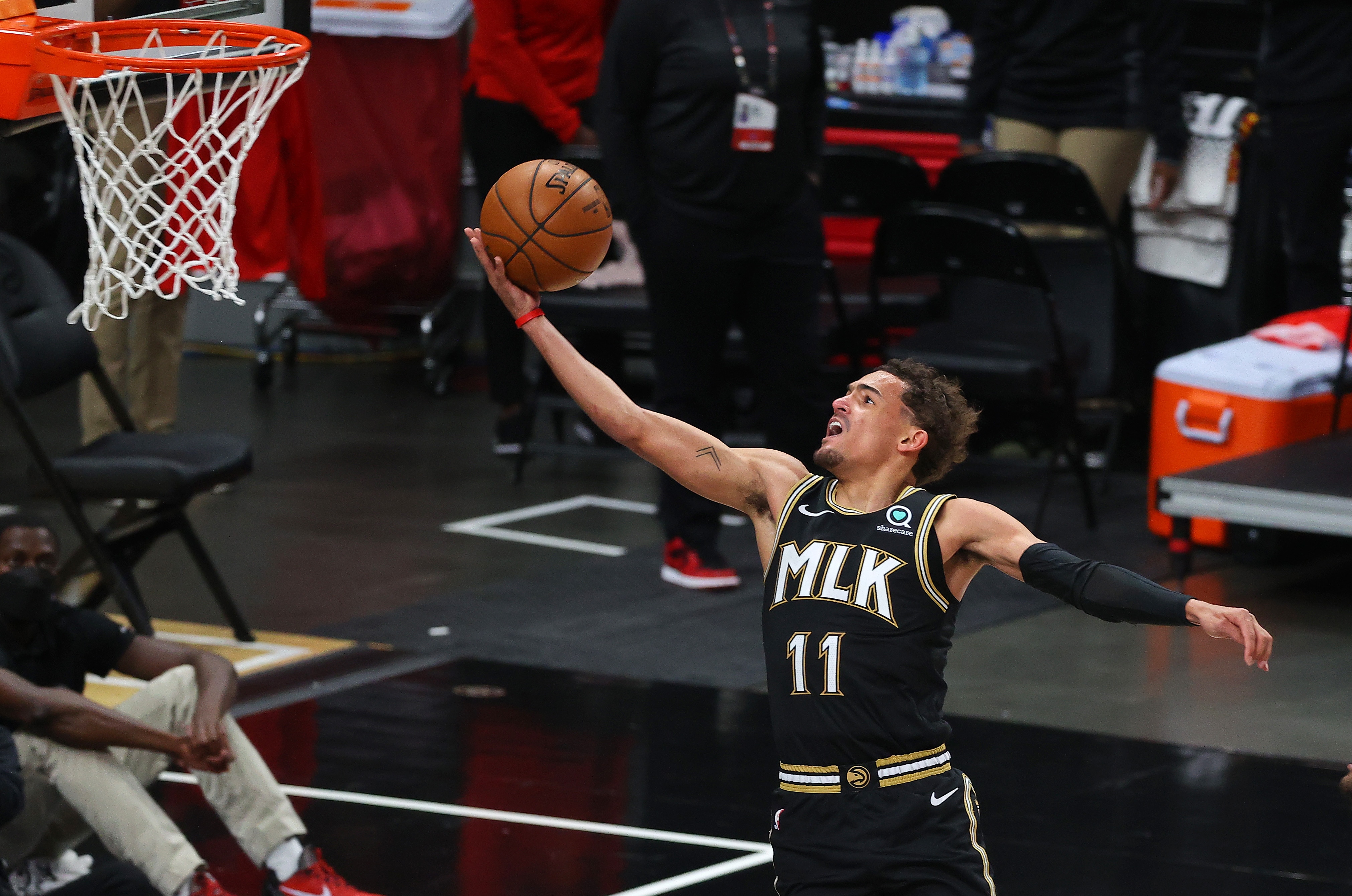 ATLANTA, GEORGIA - JULY 03: Trae Young #11 of the Atlanta Hawks goes up for a shot against the Milwaukee Bucks during the second half in Game Six of the Eastern Conference Finals at State Farm Arena on July 03, 2021 in Atlanta, Georgia NOTE TO USER: User expressly acknowledges and agrees that, by downloading and or using this photograph, User is consenting to the terms and conditions of the Getty Images License Agreement. (Photo by Kevin C. Cox/Getty Images)