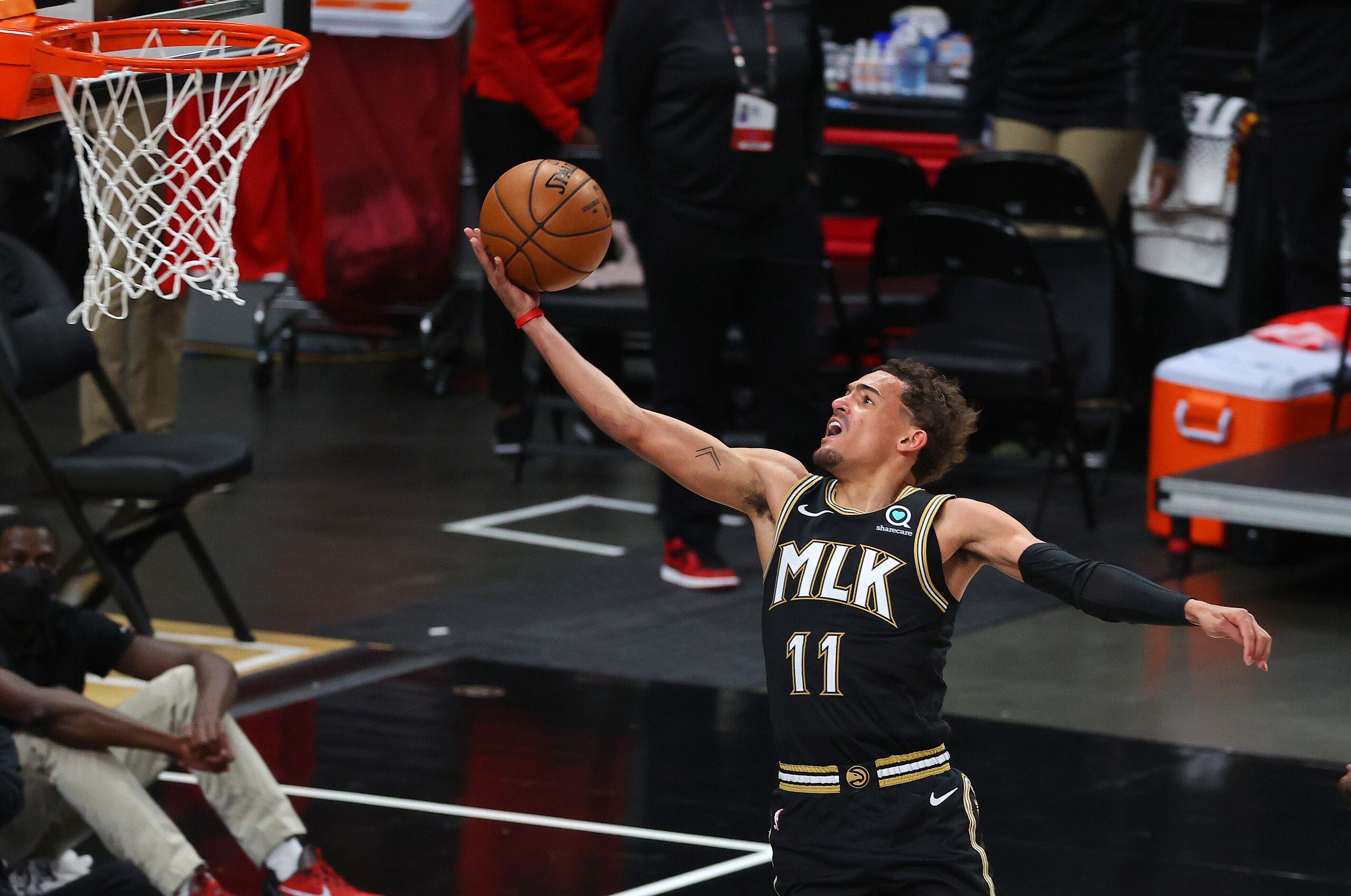 ATLANTA, GEORGIA - JULY 03: Trae Young #11 of the Atlanta Hawks goes up for a shot against the Milwaukee Bucks during the second half in Game Six of the Eastern Conference Finals at State Farm Arena on July 03, 2021 in Atlanta, Georgia NOTE TO USER: User expressly acknowledges and agrees that, by downloading and or using this photograph, User is consenting to the terms and conditions of the Getty Images License Agreement. (Photo by Kevin C. Cox/Getty Images)