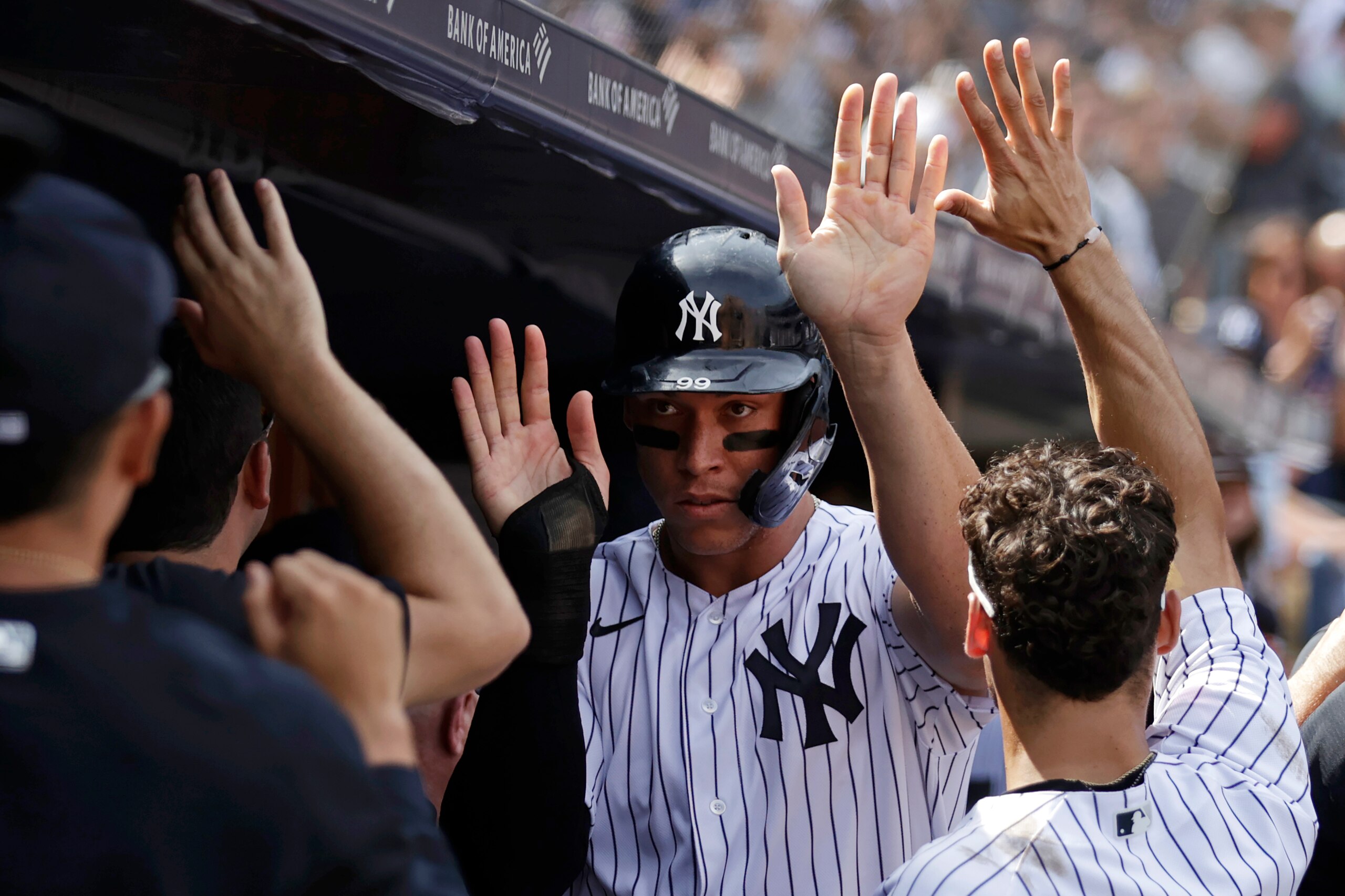 NEW YORK, NY - AUGUST 17: Aaron Judge #99 of the New York Yankees celebrates with teammates after scoring a run against the Boston Red Sox in the fifth inning during game one of a doubleheader at Yankee Stadium on August 17, 2021 in New York City. (Photo by Adam Hunger/Getty Images)