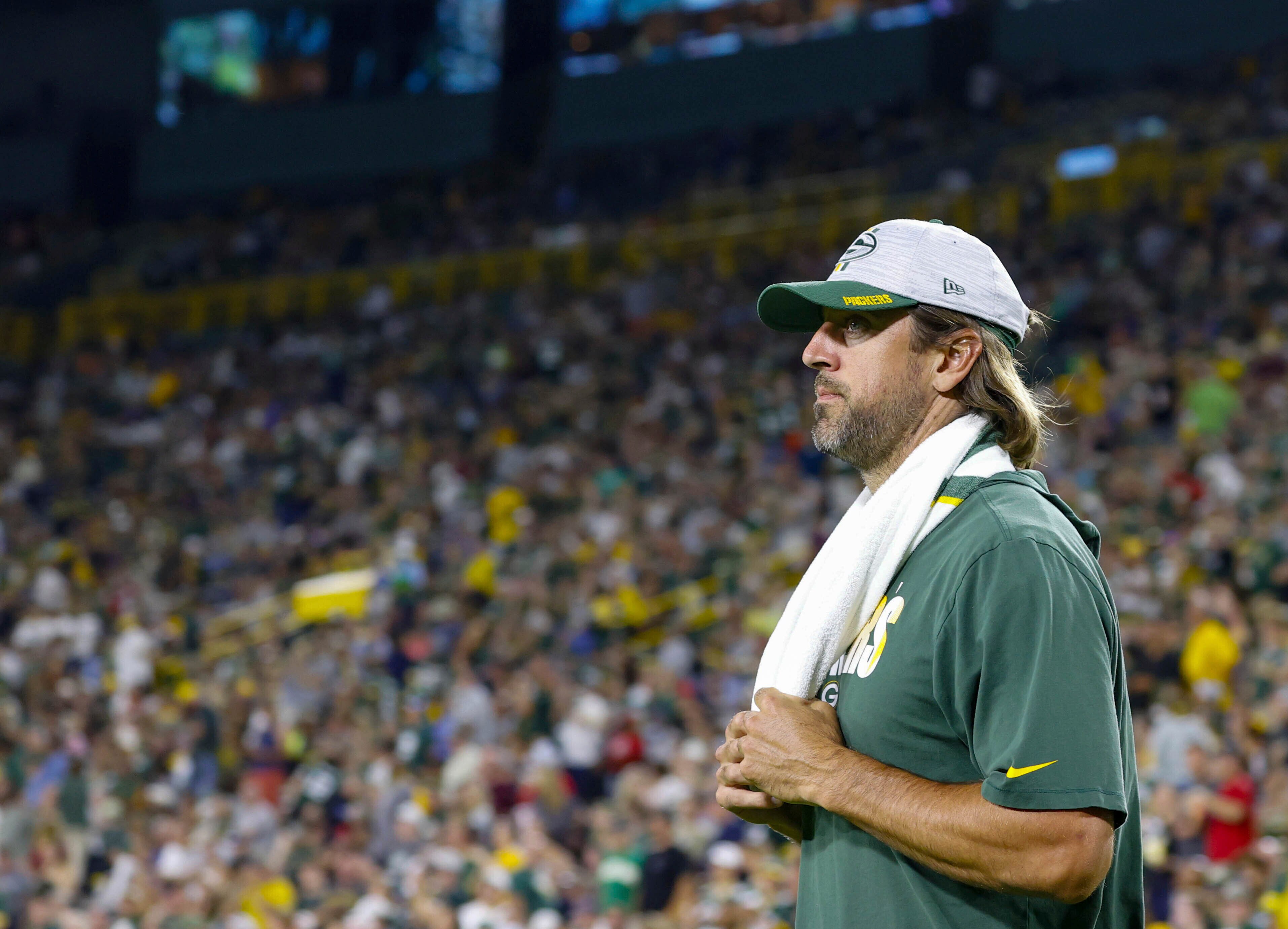 Green Bay Packers' Aaron Rodgers watches the action during the Green Bay Packers' preseason NFL football game against the Houston Texans Saturday, Aug.14,2021 in Green Bay, Wis. (AP Photo/Jeffrey Phelps)