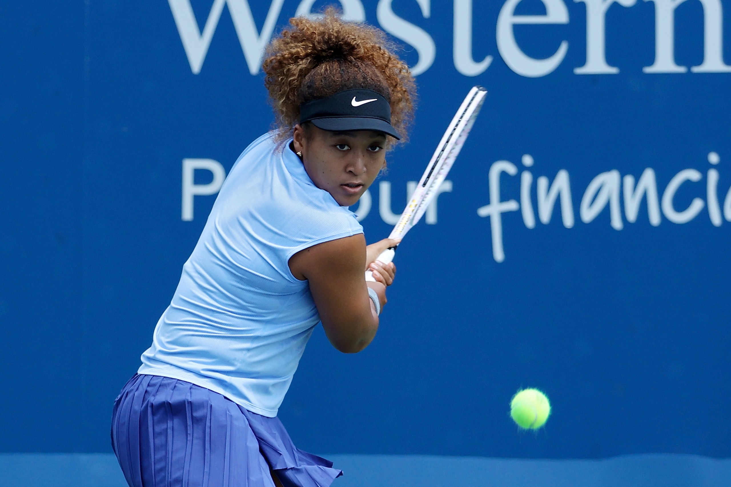 MASON, OHIO - AUGUST 18: Naomi Osaka of Japan plays a backhand during her match against Cori Gauff during Western & Southern Open - Day 4 at Lindner Family Tennis Center on August 18, 2021 in Mason, Ohio. (Photo by Dylan Buell/Getty Images)