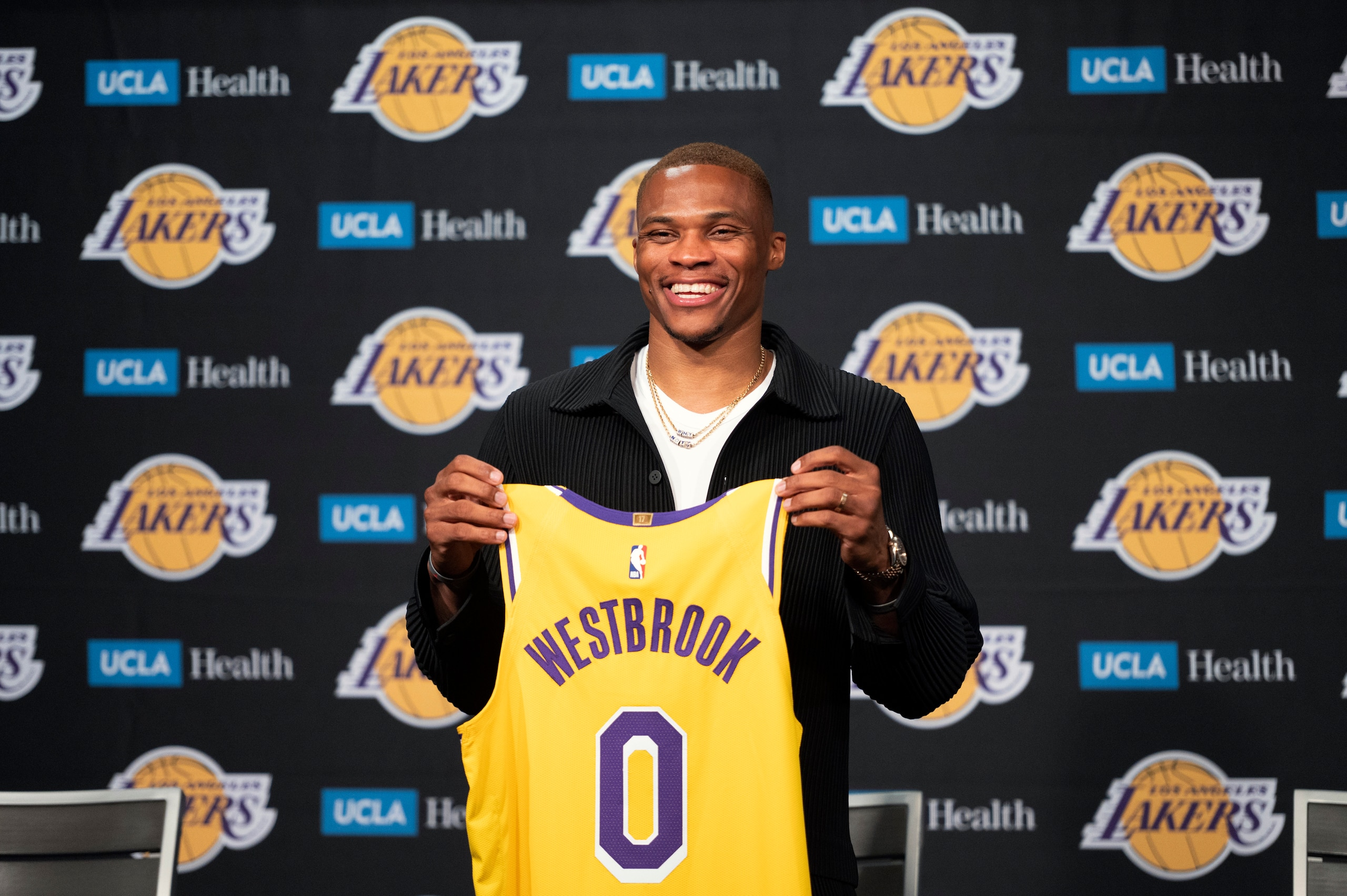 Los Angeles Lakers guard Russell Westbrook poses for a photo with his jersey at an introductory NBA basketball news conference in Los Angeles, Tuesday, Aug. 10, 2021. (AP Photo/Kyusung Gong) Los Angeles Lakers guard Russell Westbrook poses for a photo with his jersey at an introductory NBA basketball news conference in Los Angeles, Tuesday, Aug. 10, 2021. (AP Photo/Kyusung Gong)
