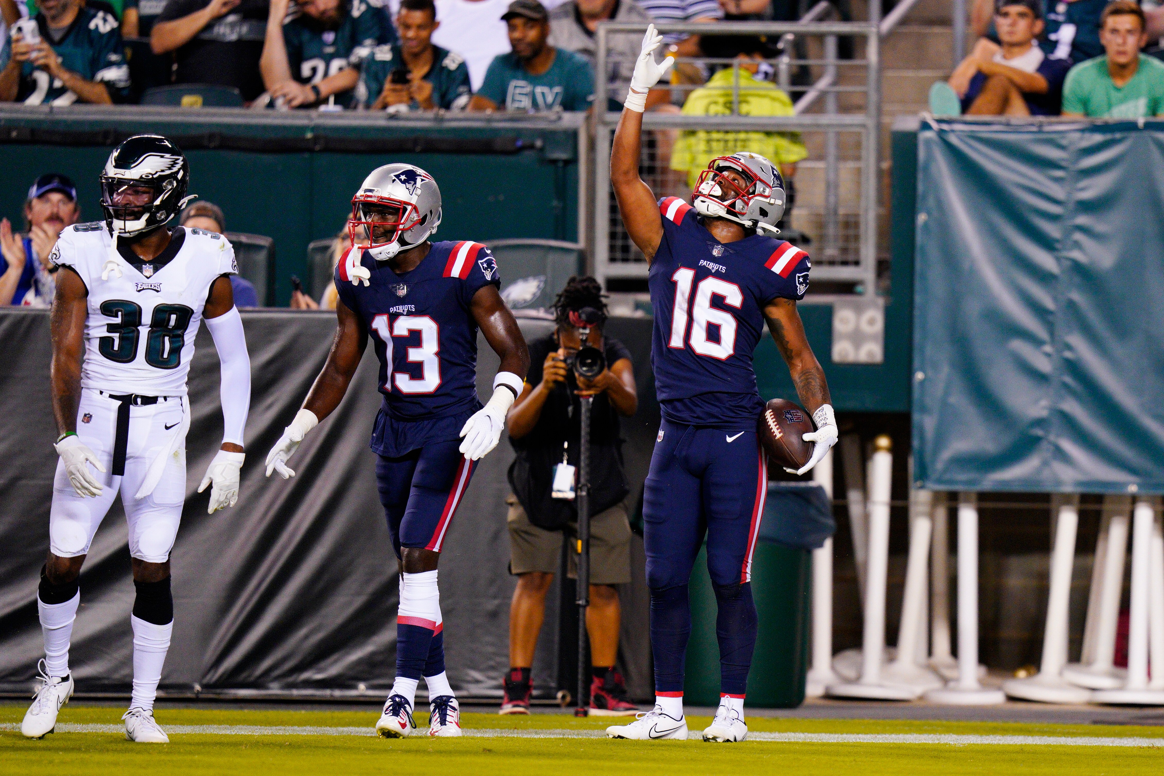 New England Patriots' Jakobi Meyers, right, celebrates his touchdown with New England Patriots' Nelson Agholor during the first half of a preseason NFL football game against the Philadelphia Eagles on Thursday, Aug. 19, 2021, in Philadelphia. (AP Photo/Chris Szagola)