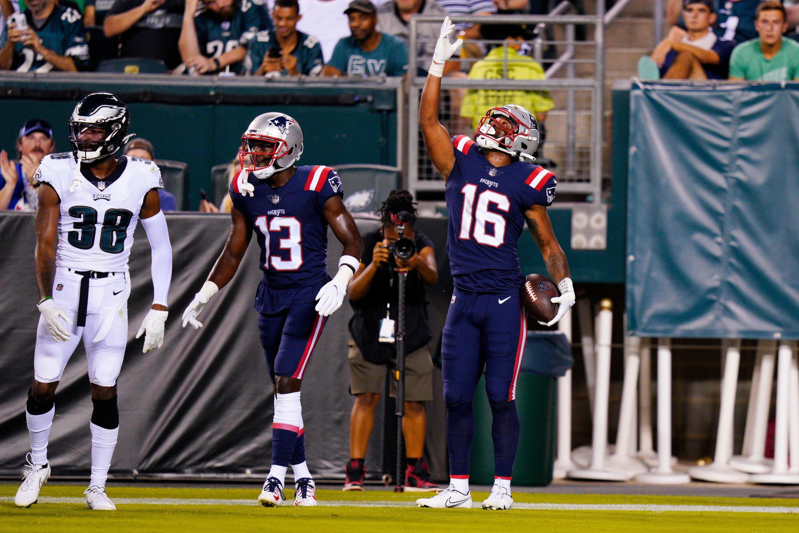 New England Patriots' Jakobi Meyers, right, celebrates his touchdown with New England Patriots' Nelson Agholor during the first half of a preseason NFL football game against the Philadelphia Eagles on Thursday, Aug. 19, 2021, in Philadelphia. (AP Photo/Chris Szagola)
