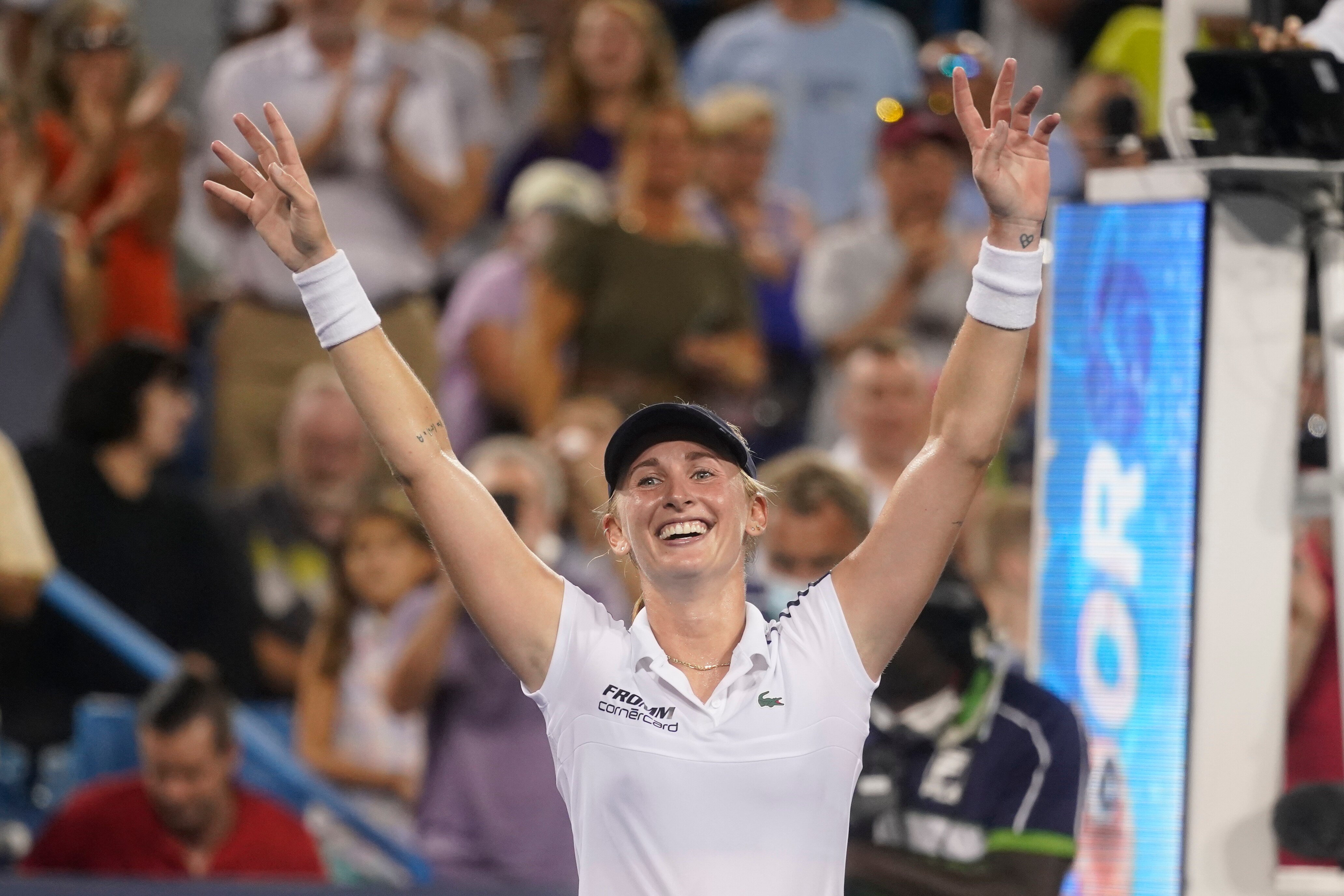 Jil Teichmann, of Switzerland, smiles after defeating Naomi Osaka, of Japan, during the Western & Southern Open tennis tournament Thursday, Aug. 19, 2021, in Mason, Ohio. (AP Photo/Darron Cummings)