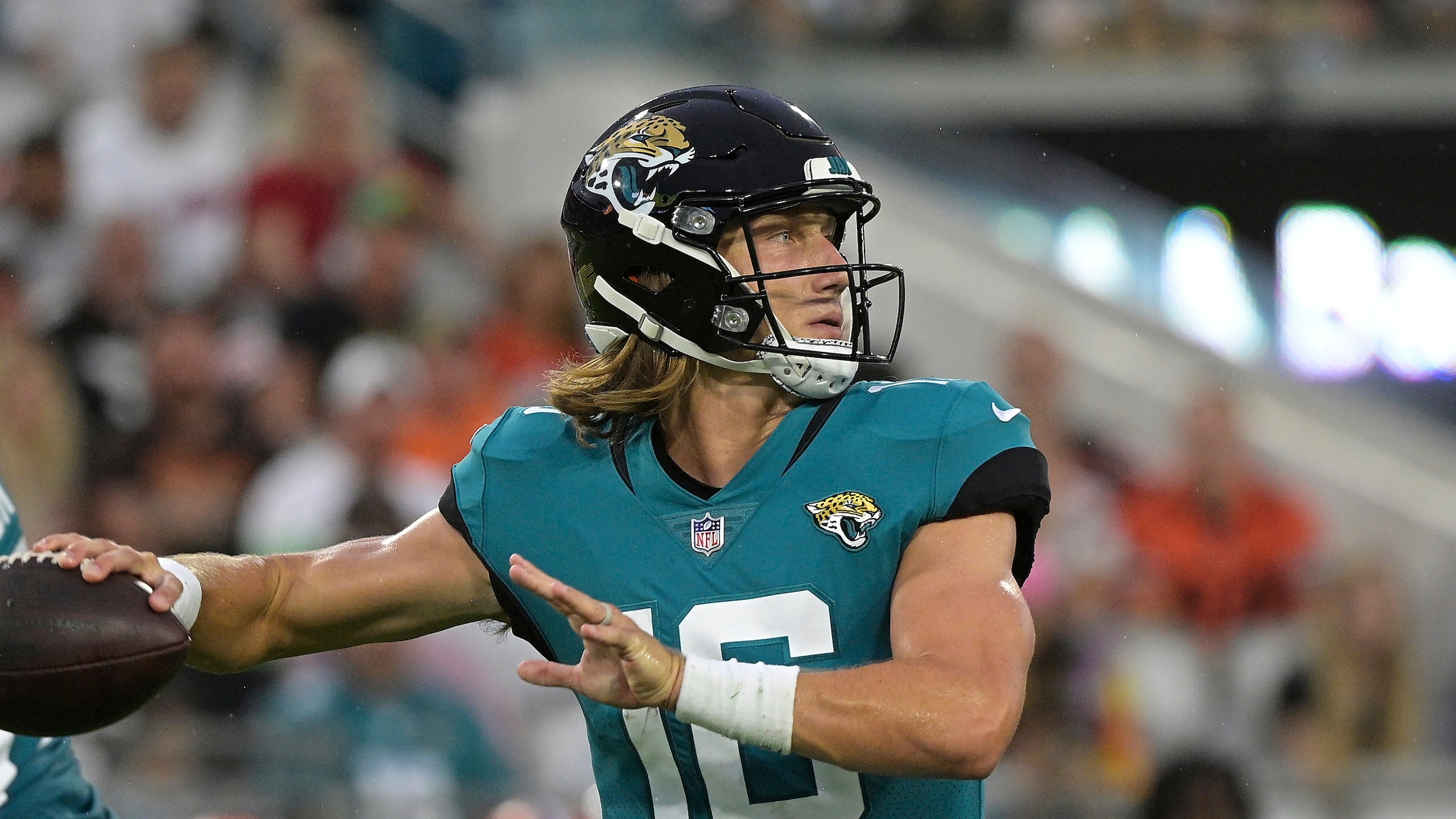 Jacksonville Jaguars quarterback Trevor Lawrence looks for a receiver against the Cleveland Browns during the first half of an NFL preseason football game, Saturday, Aug. 14, 2021, in Jacksonville, Fla. (AP Photo/Phelan M. Ebenhack)