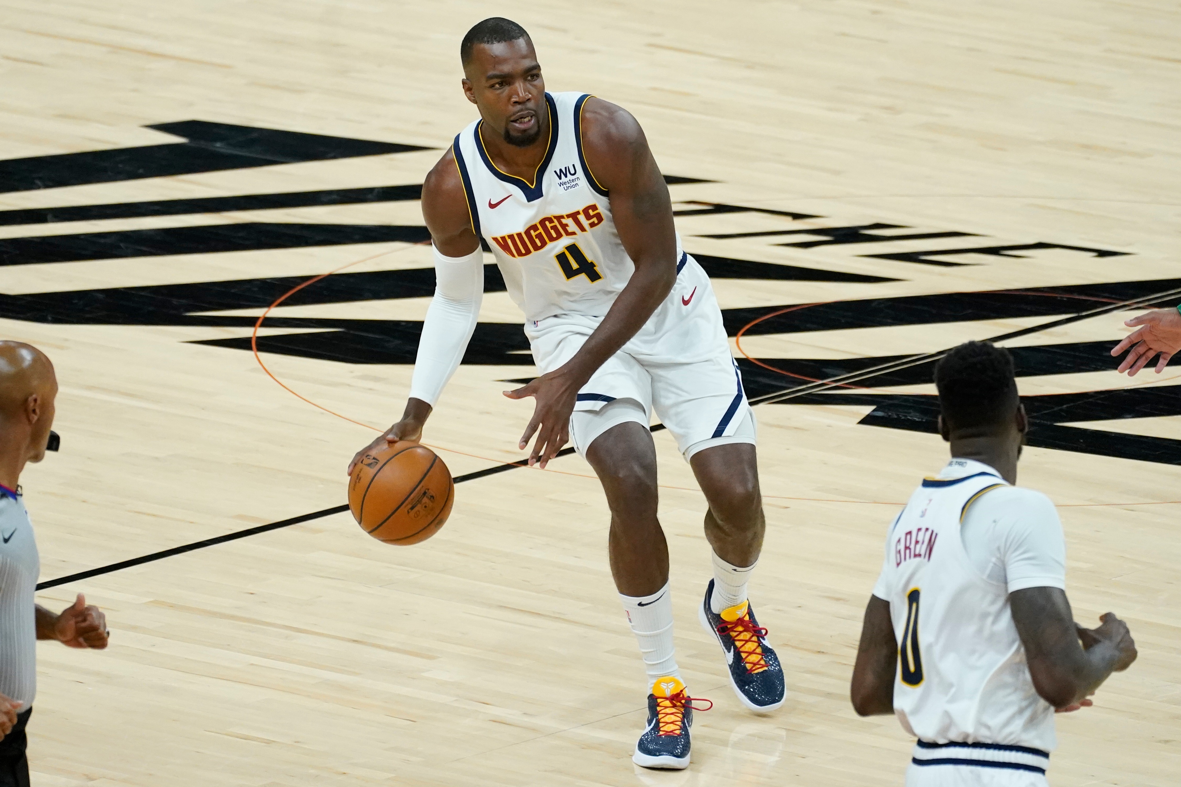 Denver Nuggets forward Paul Millsap (4) against the Phoenix Suns during Game 1 of an NBA basketball second-round playoff series, Monday, June 7, 2021, in Phoenix. (AP Photo/Matt York)