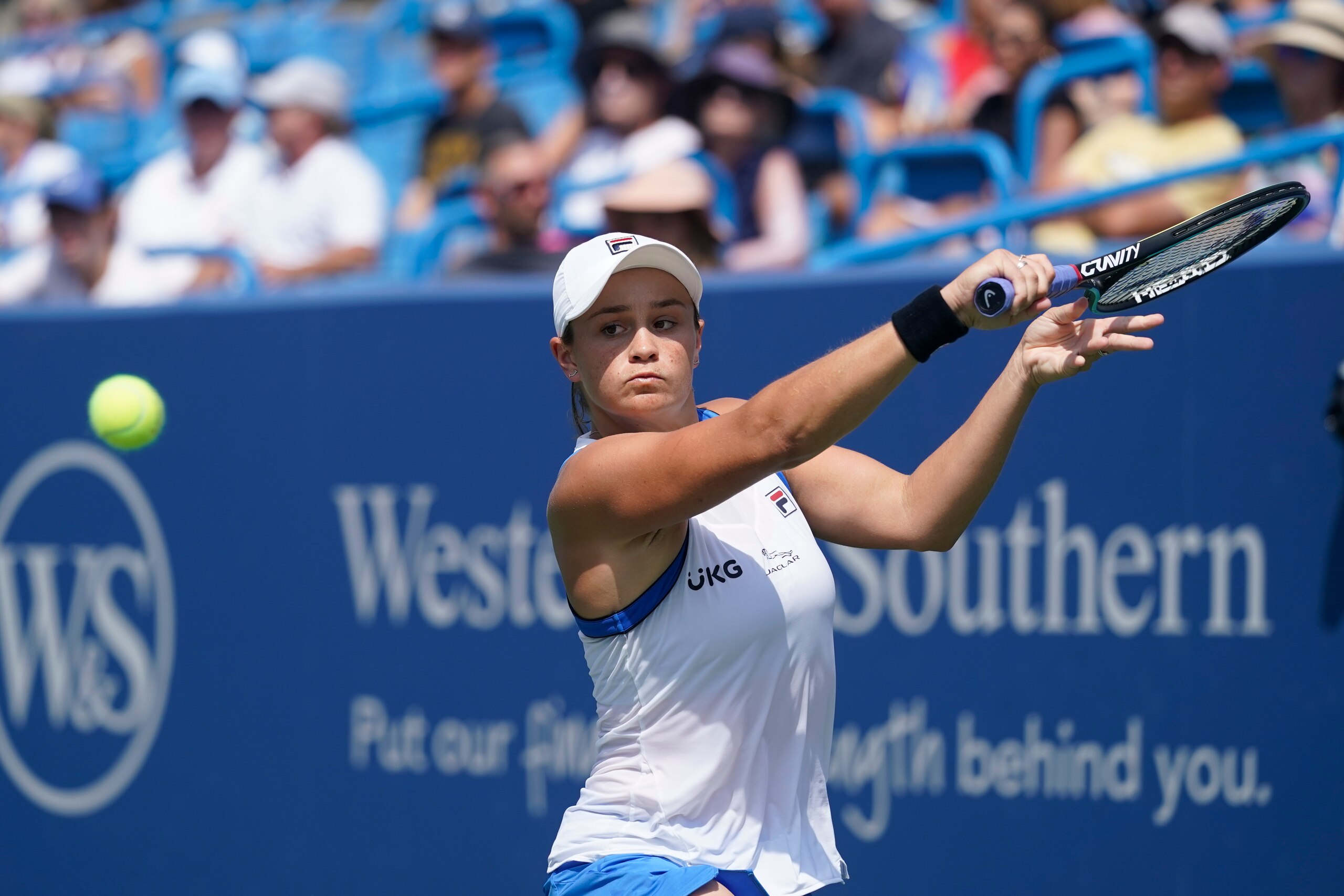 Ashleigh Barty, of Australia, returns a shot to Barbora Krejcikova, of the Czech Republic, during the Western & Southern Open tennis tournament, Friday, Aug. 20, 2021, in Mason, Ohio. (AP Photo/Darron Cummings)