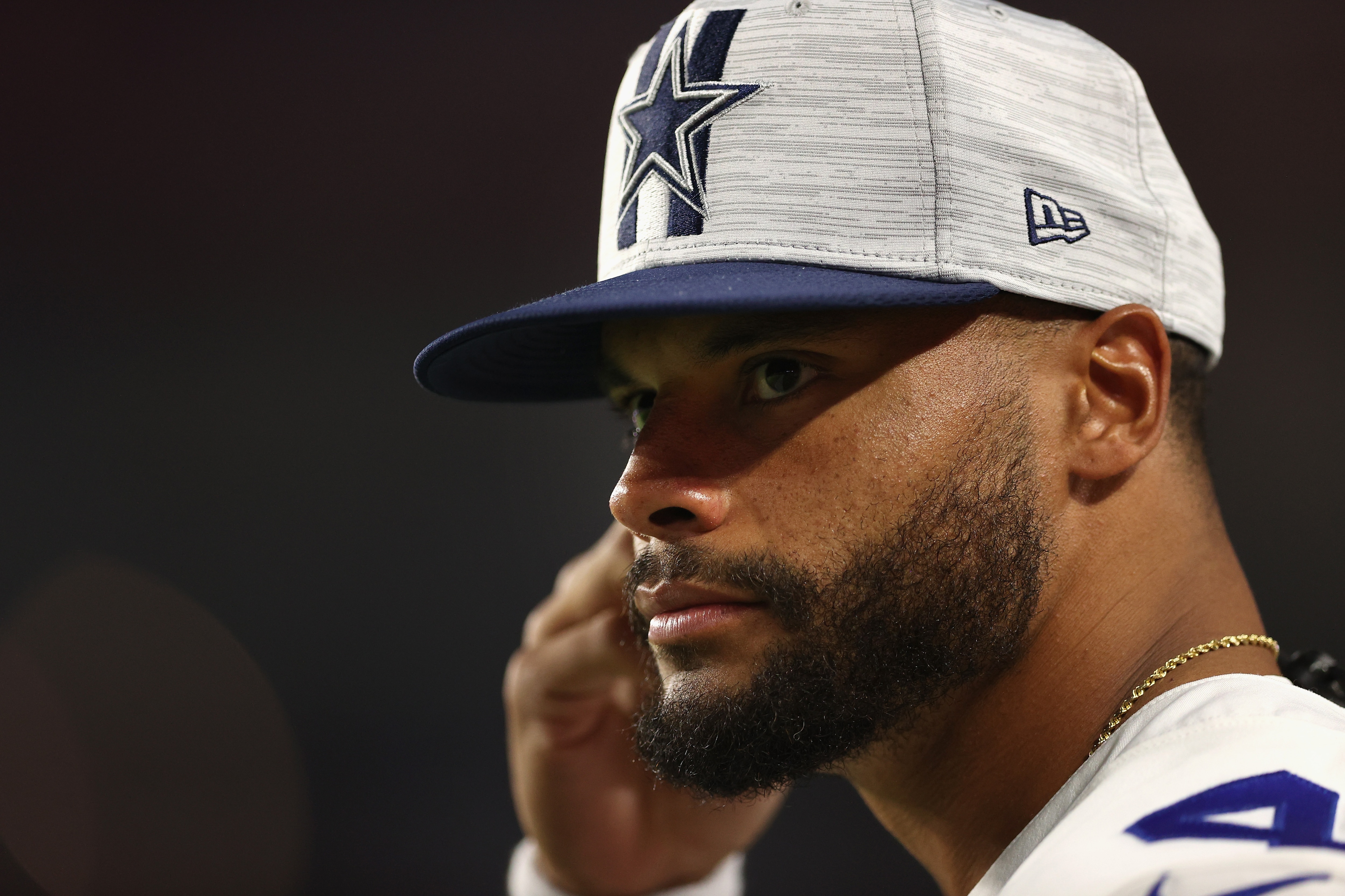 GLENDALE, ARIZONA - AUGUST 13: Quarterback Dak Prescott #4 of the Dallas Cowboys watches from the sidelines during the first half of the NFL preseason game against the Arizona Cardinals at State Farm Stadium on August 13, 2021 in Glendale, Arizona. The Cardinals defeated the Dallas Cowboys 19-16. (Photo by Christian Petersen/Getty Images)