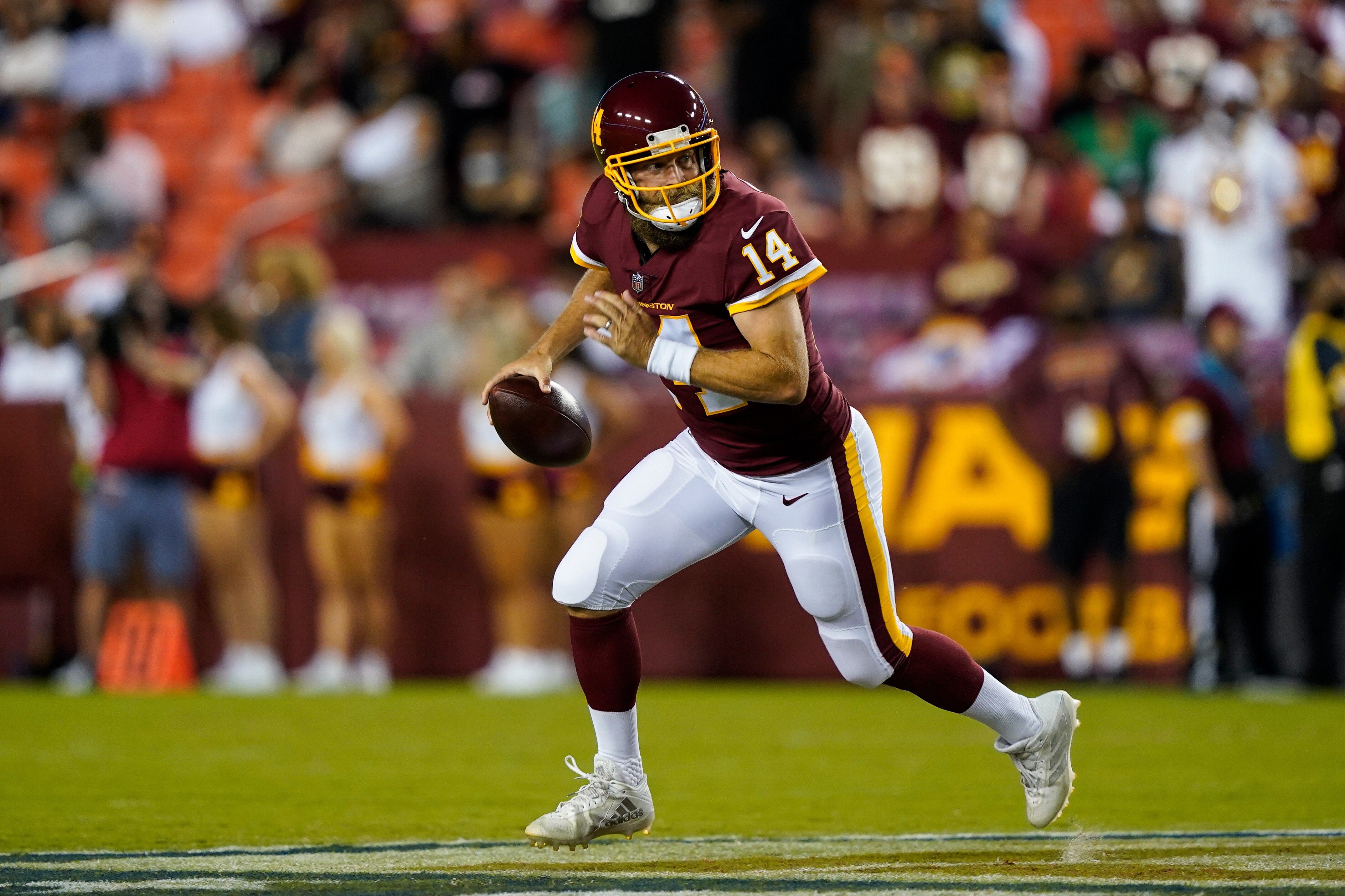 Washington Football Team quarterback Ryan Fitzpatrick (14) looks to pass during the first half of a preseason NFL football game against the Cincinnati Bengals, Friday, Aug. 20, 2021, in Landover, Md. (AP Photo/Susan Walsh)