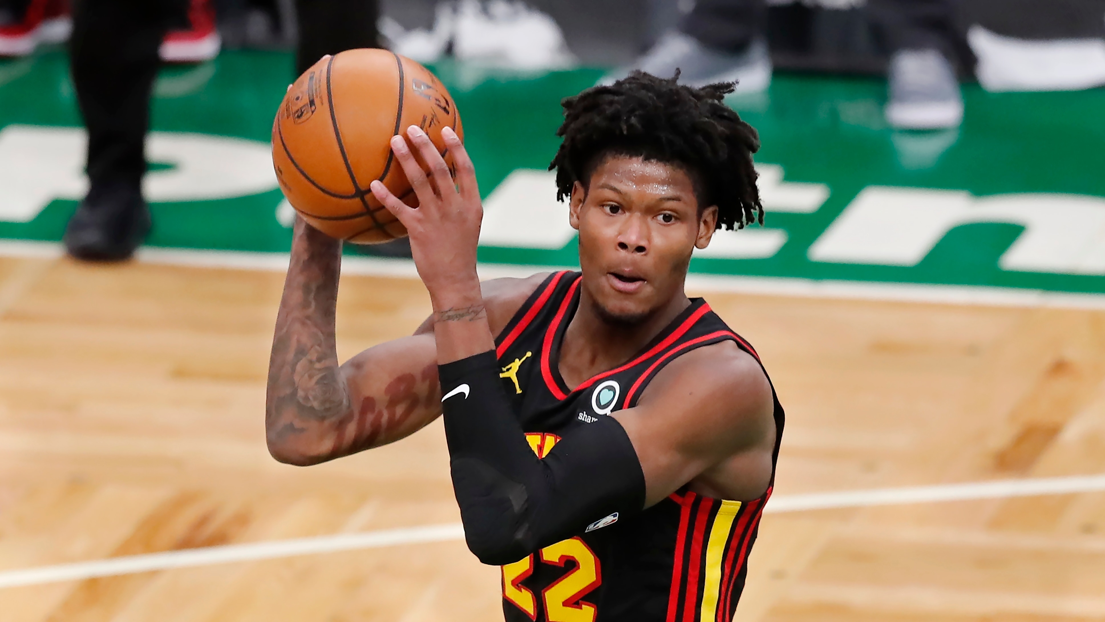 Atlanta Hawks' Cam Reddish plays against the Boston Celtics during the first half of an NBA basketball game, Friday, Feb. 19, 2021, in Boston. (AP Photo/Michael Dwyer)