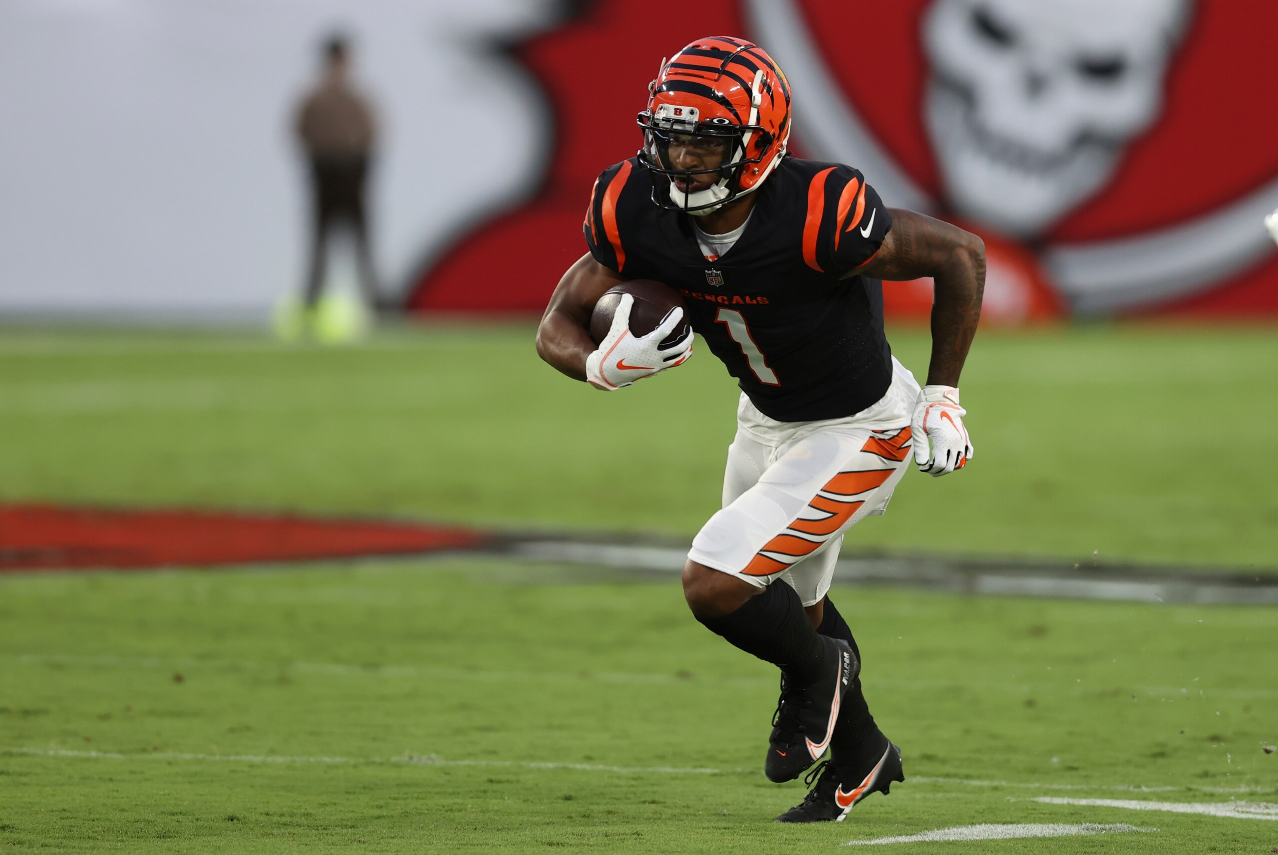 Cincinnati Bengals wide receiver Ja'Marr Chase (1) runs against the Tampa Bay Buccaneers during the first half of an NFL preseason football game Saturday, Aug. 14, 2021, in Tampa, Fla. (AP Photo/Mark LoMoglio)