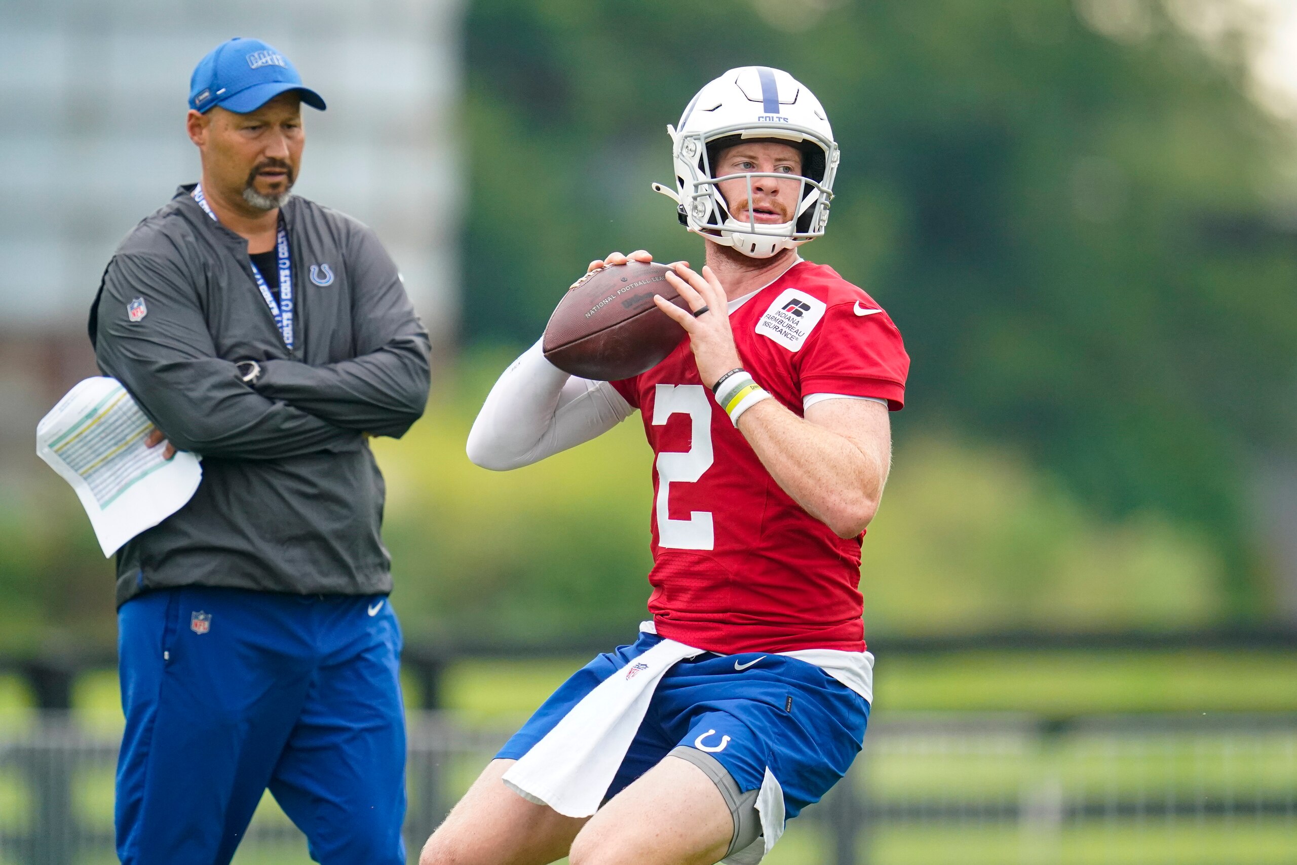 Indianapolis Colts quarterback Carson Wentz runs a drill during practice at the NFL team's football training camp in Westfield, Ind., Thursday, July 29, 2021. (AP Photo/Michael Conroy)