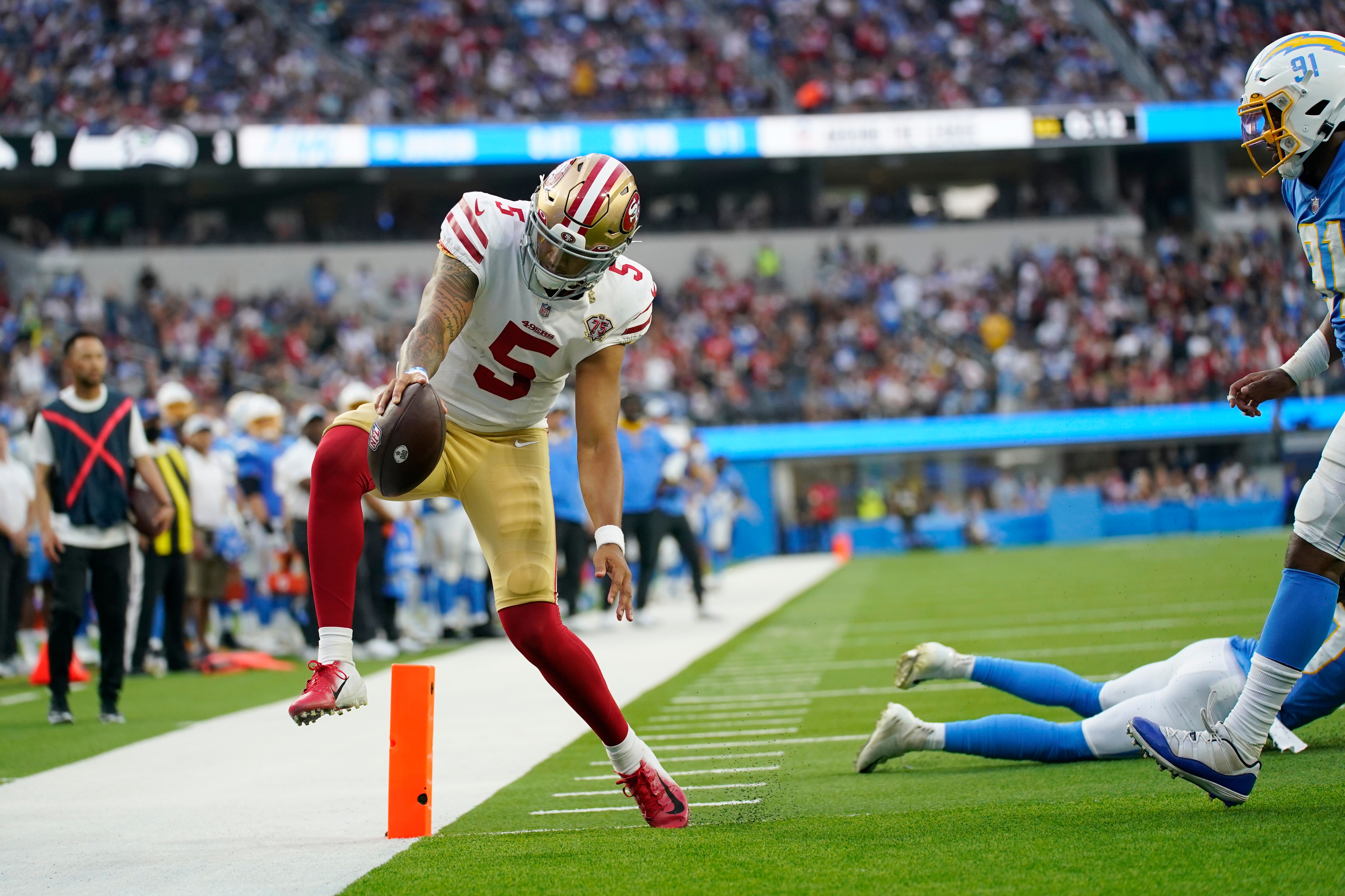 San Francisco 49ers quarterback Trey Lance (5) reaches the end zone on a a failed two-point conversion attempt during the first half of a preseason NFL football game Sunday, Aug. 22, 2021, in Inglewood, Calif. (AP Photo/Ashley Landis)