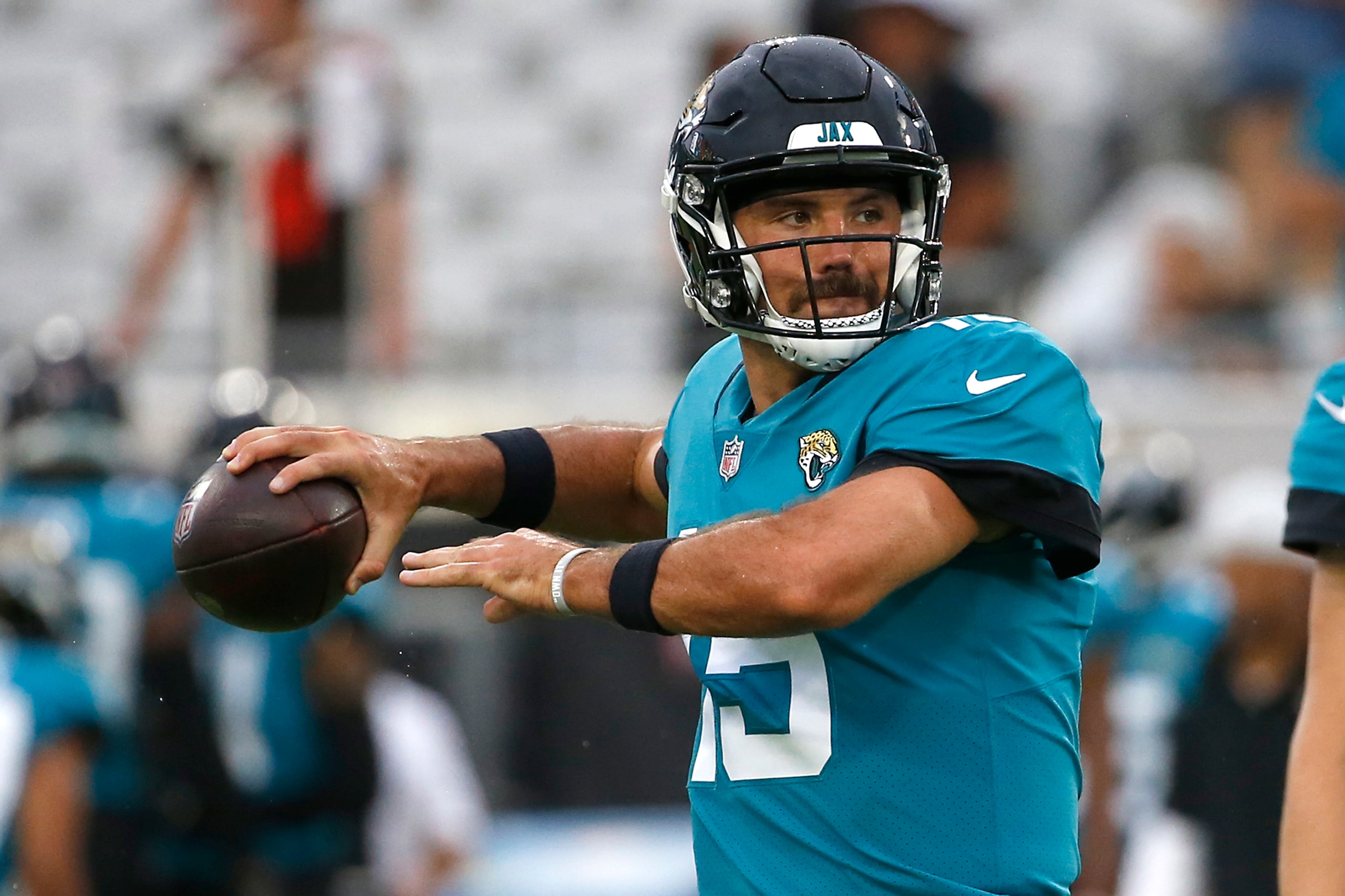 Jacksonville Jaguars quarterback Gardner Minshew (15) warms up before an NFL preseason football game against the Cleveland Browns, Saturday, Aug. 14, 2021, in Jacksonville, Fla. (AP Photo/Stephen B. Morton)