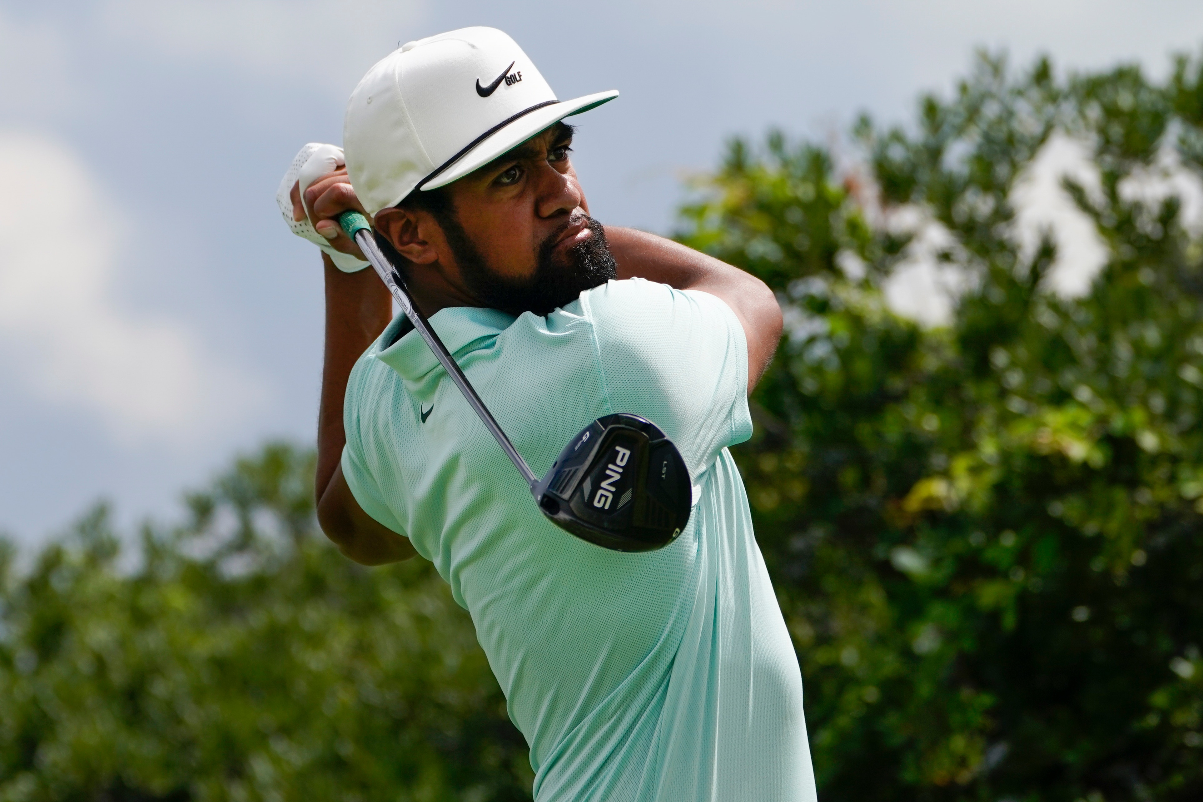 Tony Finau tees off on the third hole in the final round at The Northern Trust golf tournament at Liberty National Golf Course Monday, Aug. 23, 2021, in Jersey City, N.J. (AP Photo/John Minchillo)