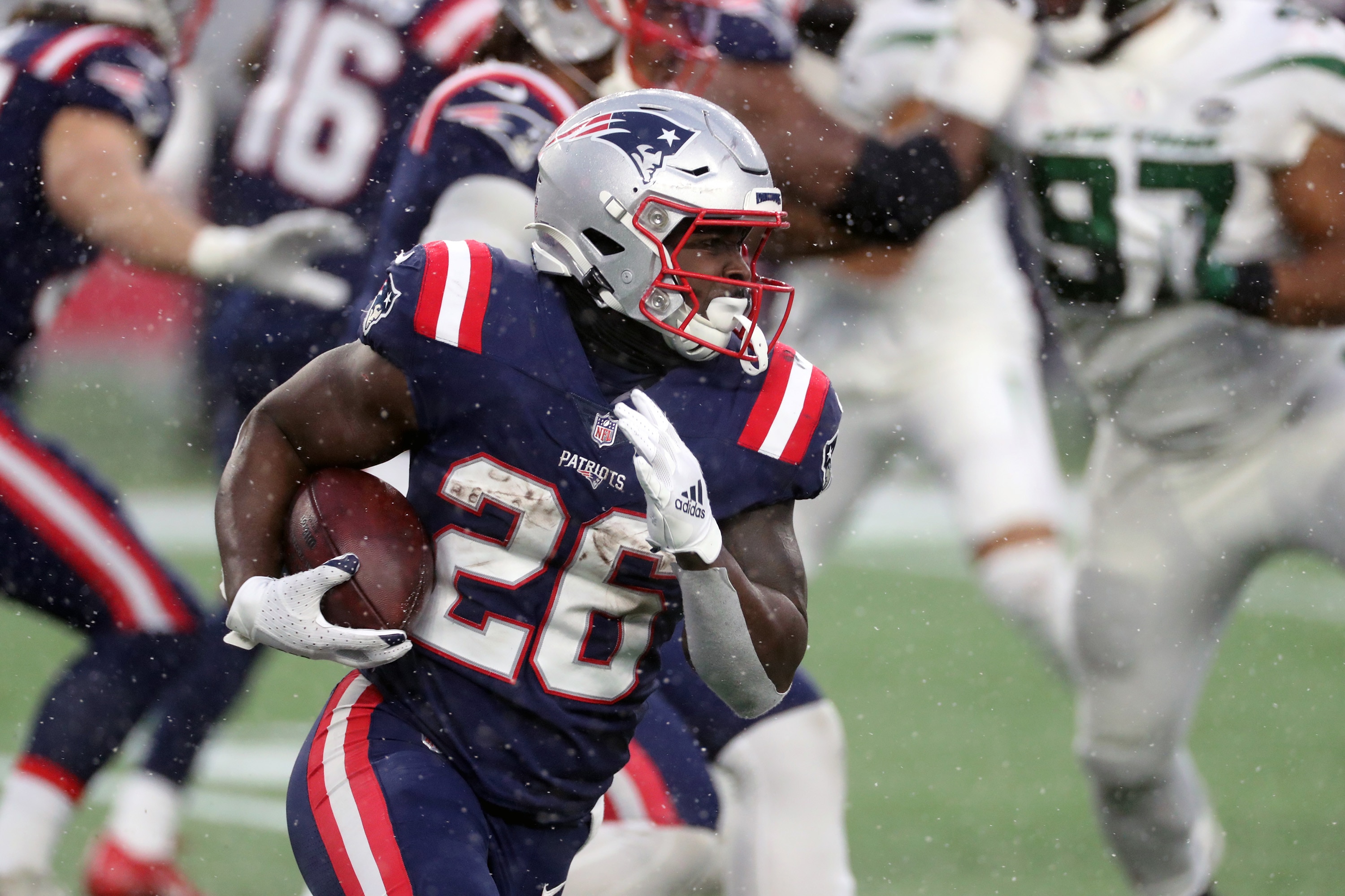 FOXBOROUGH, MA - JANUARY 03: Sony Michel #26 of the New England Patriots has a long gain in the snow against the New York Jets at Gillette Stadium on January 3, 2021 in Foxborough, Massachusetts. (Photo by Al Pereira/Getty Images)