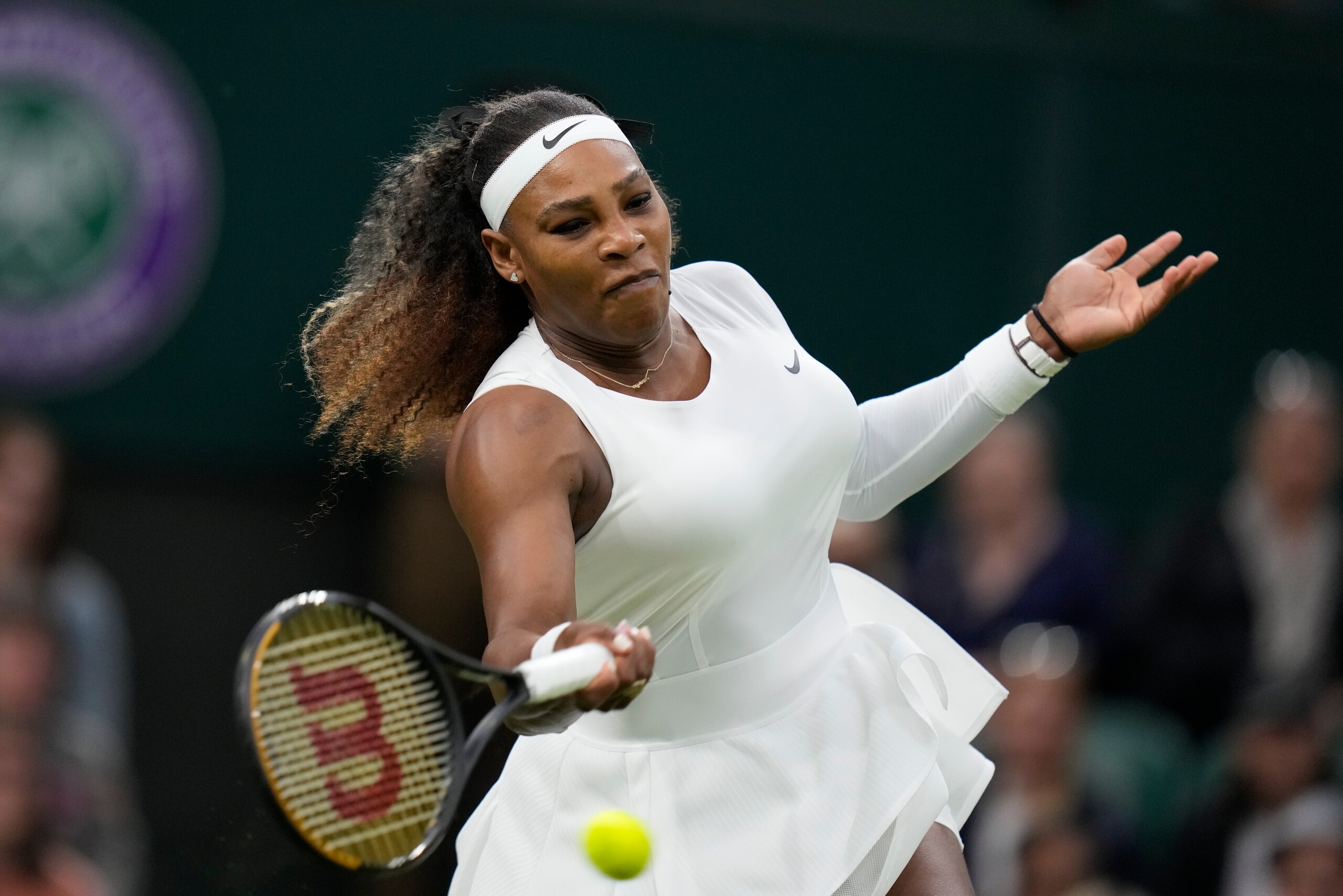 Serena Williams of the US plays a return to Aliaksandra Sasnovich of Belarus for the women's singles first round match on day two of the Wimbledon Tennis Championships in London, Tuesday June 29, 2021. (AP Photo/Kirsty Wigglesworth)