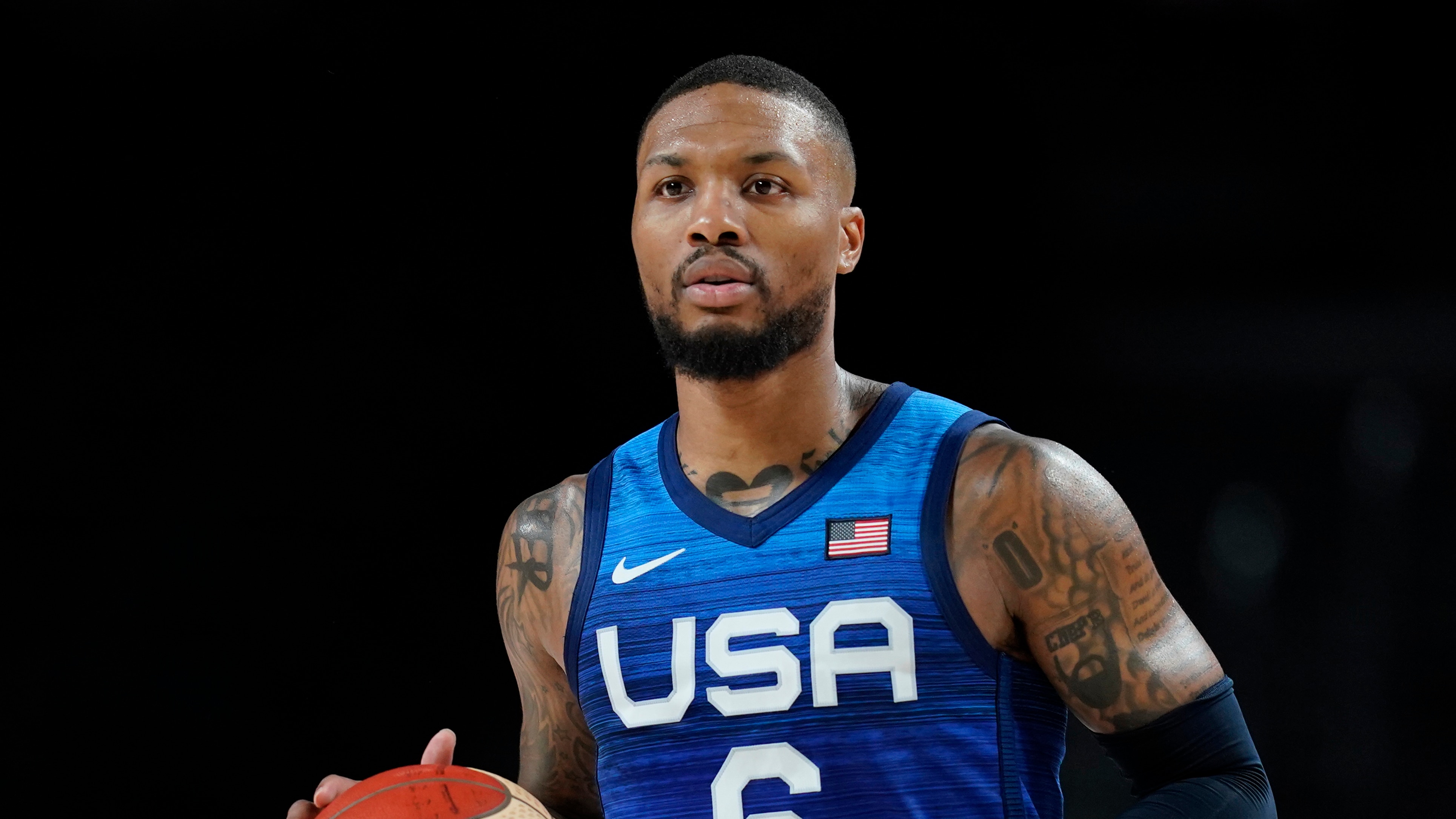 United States' Damian Lillard (6) drives to the basket during men's basketball quarterfinal game against Spain at the 2020 Summer Olympics, Tuesday, Aug. 3, 2021, in Saitama, Japan. (AP Photo/Charlie Neibergall)