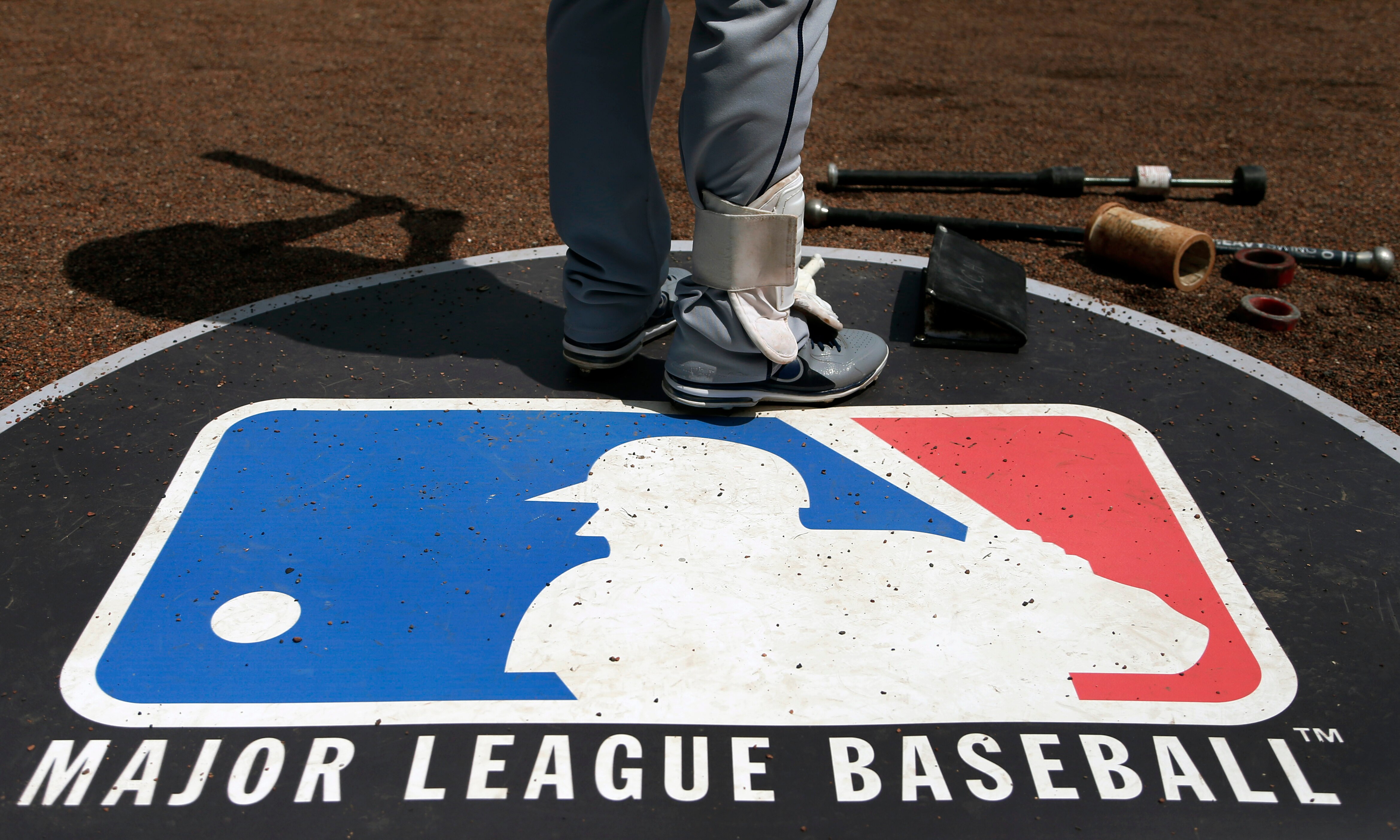 FILE - In this April 24, 2013, file photo, Cleveland Indians second baseman Jason Kipnis stands on the Major League Baseball logo that serves as the on deck circle during the first inning of a baseball game between the Chicago White Sox and the Indians, in Chicago. Major League Baseball rejected the players' offer for a 114-game regular season in the pandemic-delayed season with no additional salary cuts and told the union it did not plan to make a counterproposal, a person familiar with the negotiations told The Associated Press. The person spoke on condition of anonymity Wednesday, June 3, 2020, because no statements were authorized.(AP Photo/Charles Rex Arbogast, File)