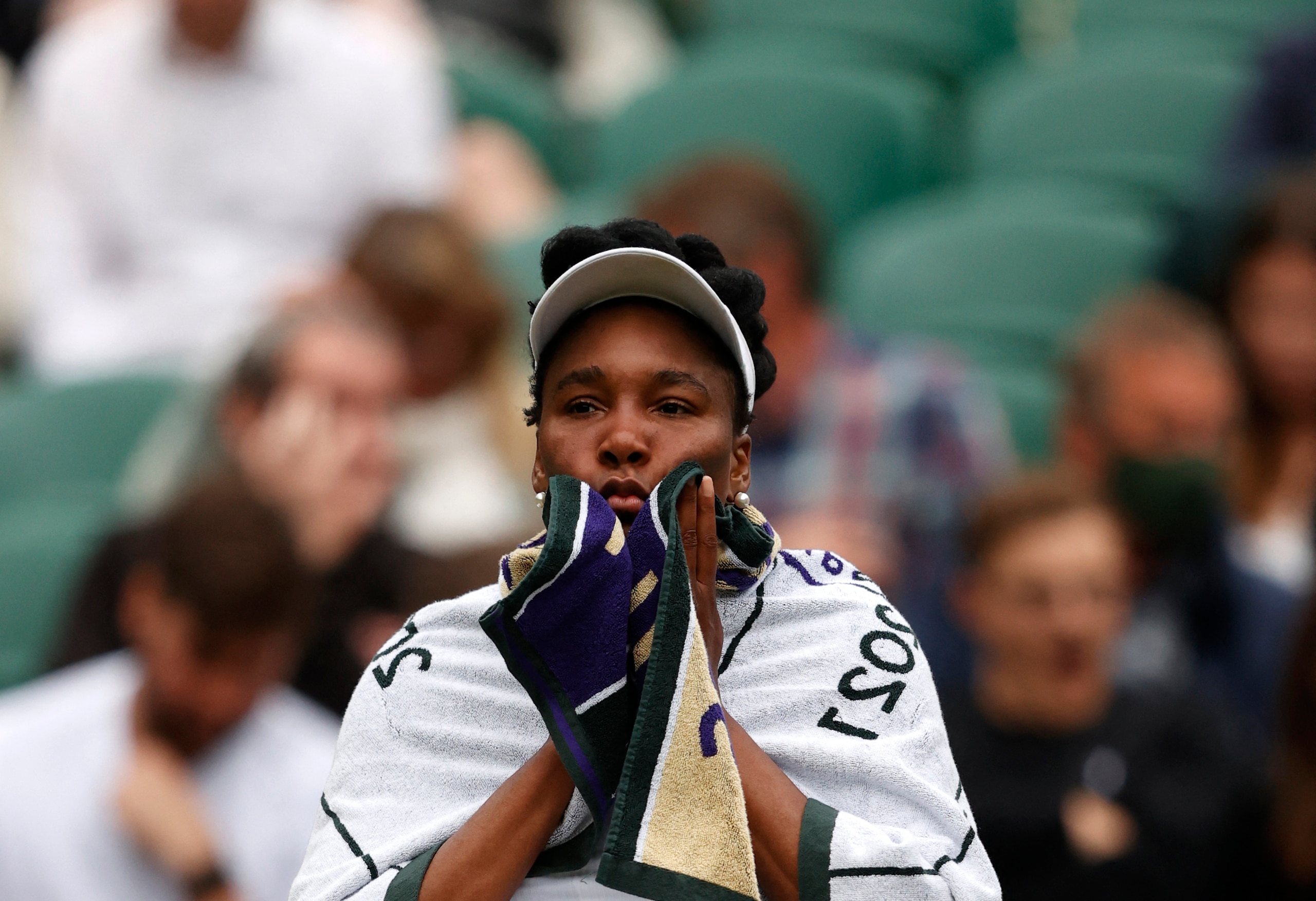 US player Venus Williams reacts while playing Tunisia's Ons Jabeur during their women's singles second round match on the third day of the 2021 Wimbledon Championships at The All England Tennis Club in Wimbledon, southwest London, on June 30, 2021. - RESTRICTED TO EDITORIAL USE (Photo by Adrian DENNIS / AFP) / RESTRICTED TO EDITORIAL USE (Photo by ADRIAN DENNIS/AFP via Getty Images)