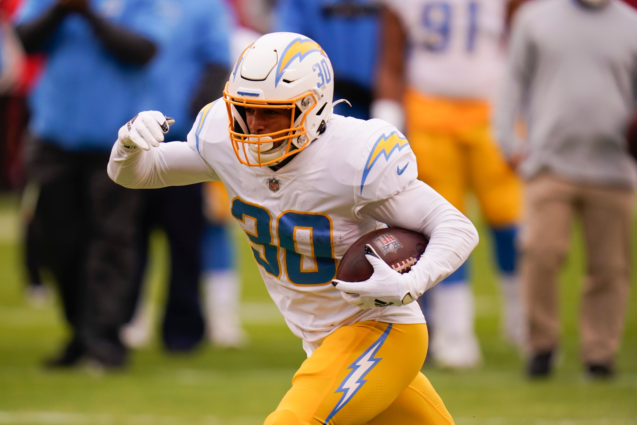 Los Angeles Chargers running back Austin Ekeler warms up before an NFL football game against the Kansas City Chiefs, Sunday, Jan. 3, 2021, in Kansas City. (AP Photo/Jeff Roberson)