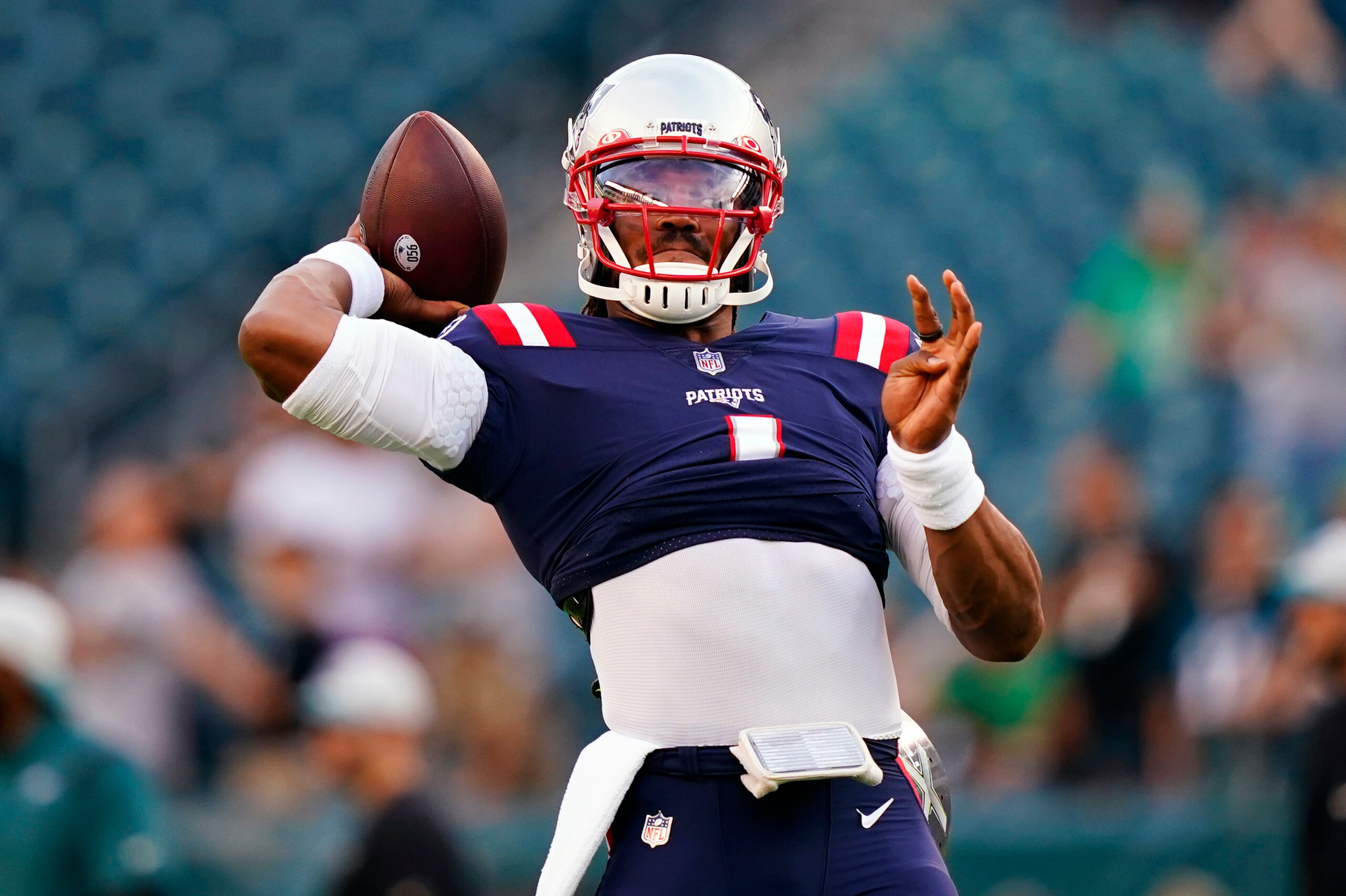 New England Patriots' Cam Newton warms up before a preseason NFL football game against the Philadelphia Eagles on Thursday, Aug. 19, 2021, in Philadelphia. (AP Photo/Matt Rourke)