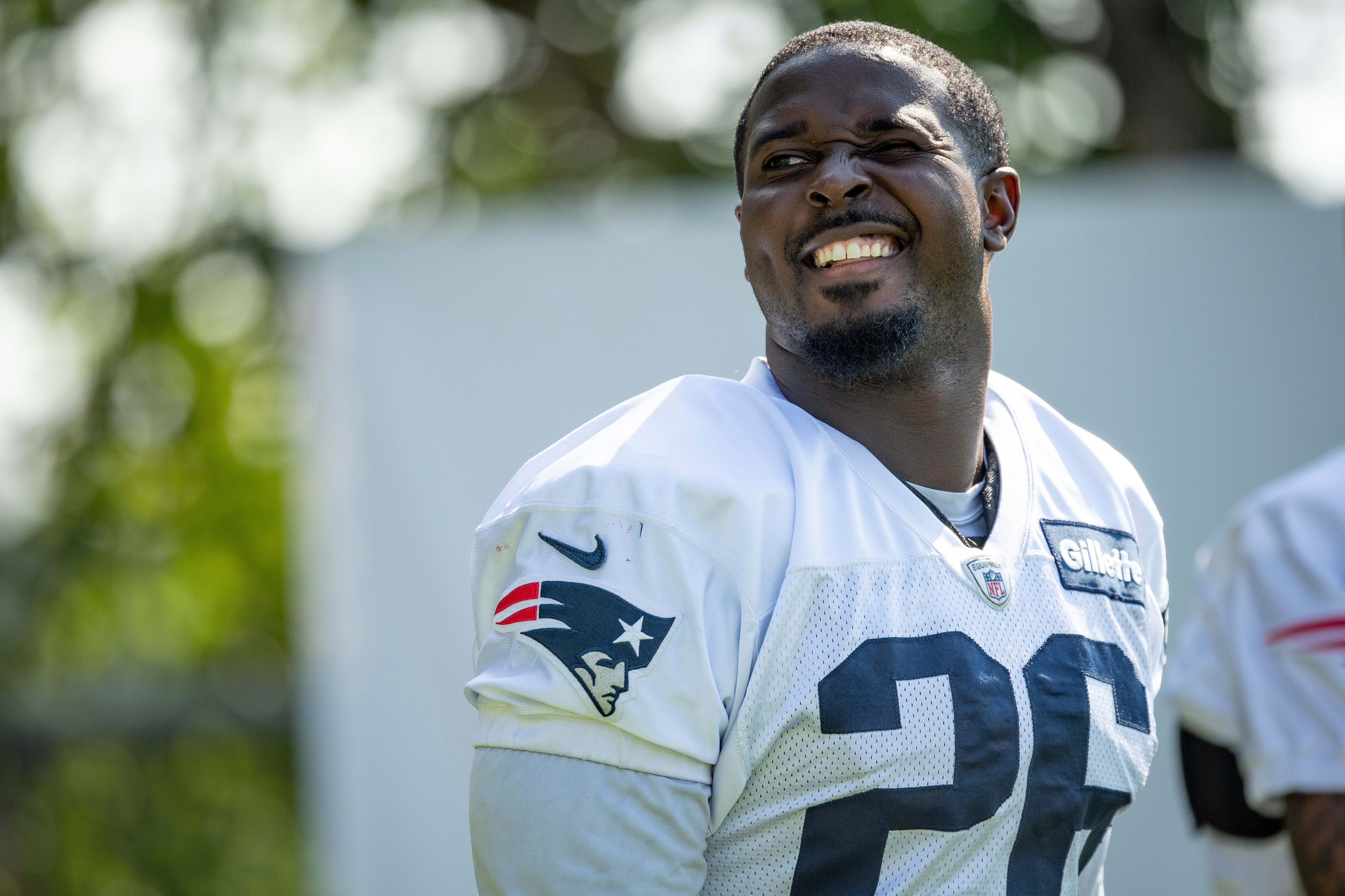 FOXBOROUGH, MASSACHUSETTS - JULY 30: Sony Michel #26 of the New England Patriots arrives at the field for Training Camp at Gillette Stadium on July 30, 2021 in Foxborough, Massachusetts. (Photo by Maddie Malhotra/Getty Images)