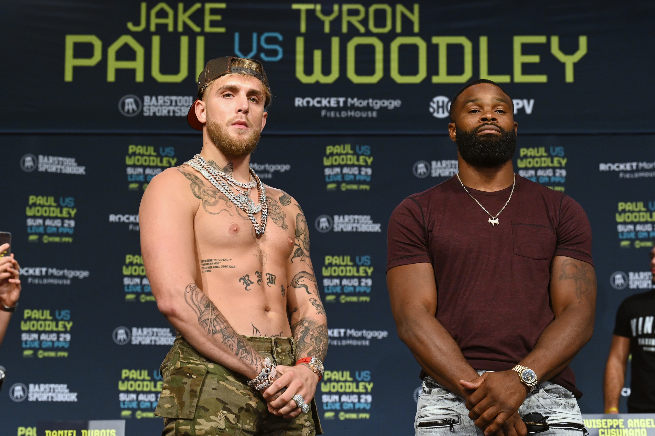 CLEVELAND, OHIO - AUGUST 26: Jake Paul and Tyron Woodley pose during a press conference at the Hilton Cleveland Downtown prior to their August 29 fight on August 26, 2021 in Cleveland, Ohio. (Photo by Jason Miller/Getty Images)