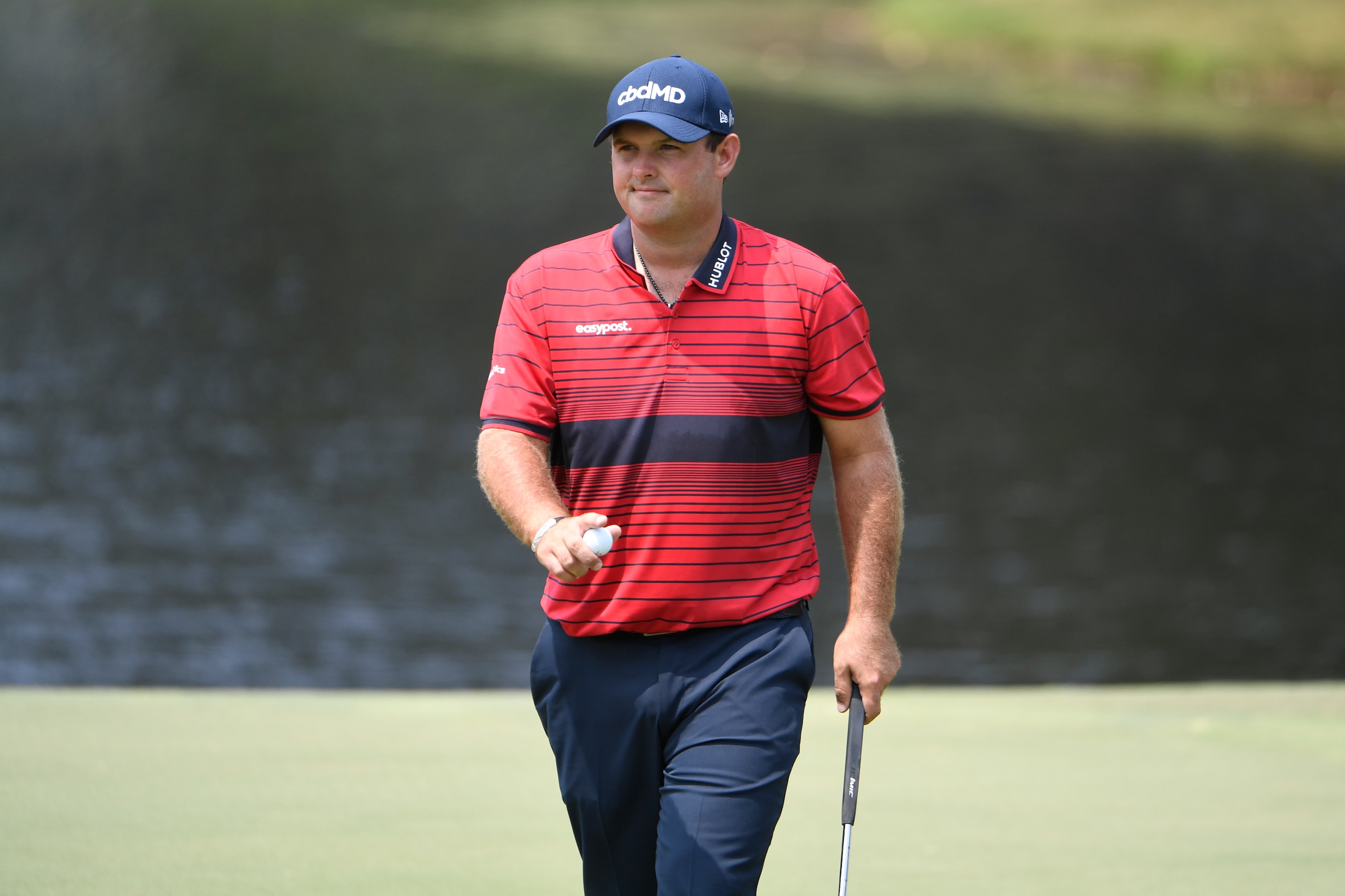 MEMPHIS, TN - AUGUST 08: Patrick Reed at the ninth green does a ball wave during the final round of the World Golf Championships-FedEx St. Jude Invitational at TPC Southwind on August 8, 2021 in Memphis, Tennessee. (Photo by Tracy Wilcox/PGA TOUR via Getty Images)