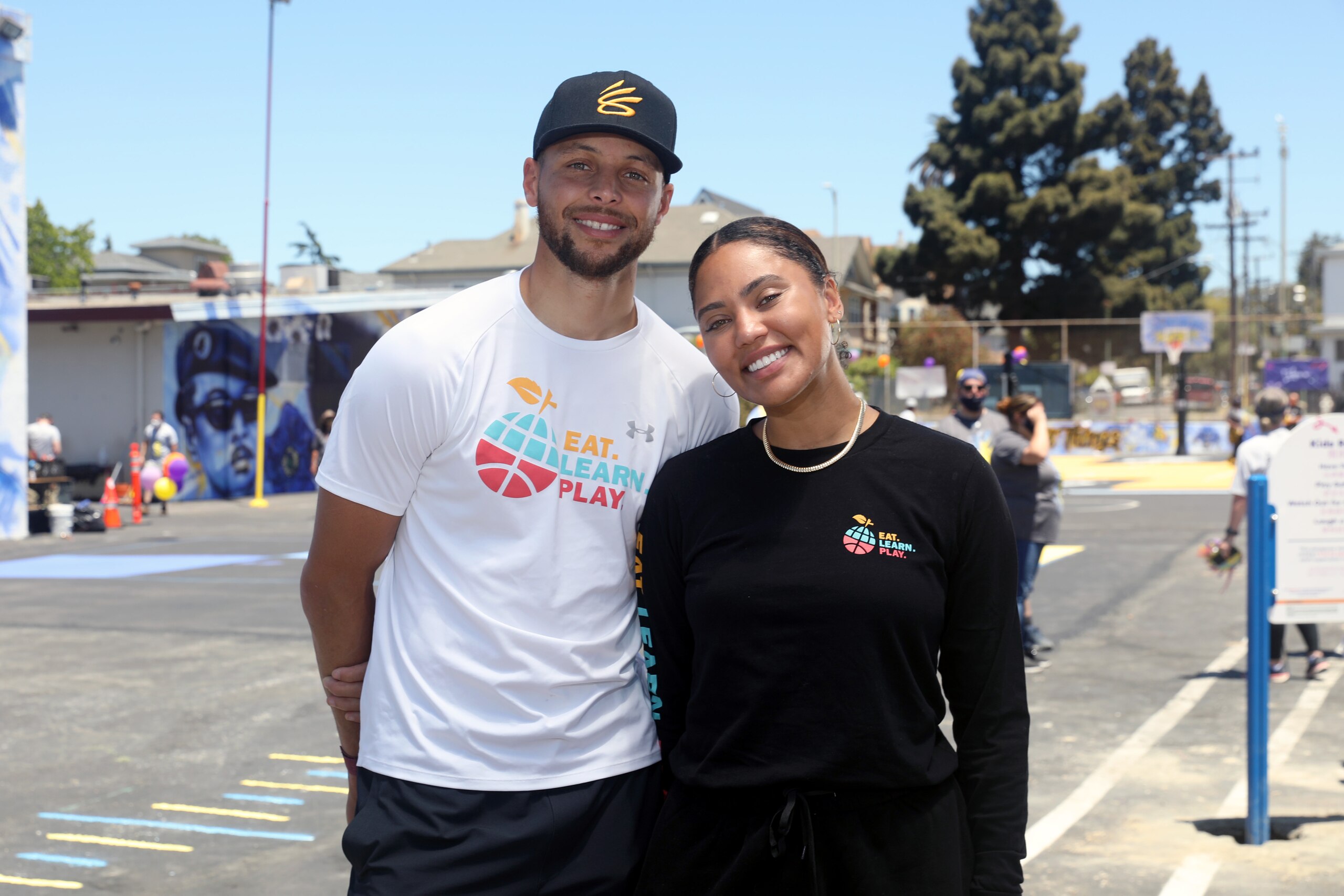 OAKLAND, CALIFORNIA - JUNE 12: (L-R) Stephen Curry and Ayesha Curry attend Eat. Learn. Play., along with partners KABOOM!, The CarMax Foundation, and Oakland Unified School District, as they unveil an amazing new playground, multi-sport court, and garden at Franklin Elementary School on June 12, 2021 in Oakland, California. (Photo by Kelly Sullivan/Getty Images for Eat. Learn. Play.) OAKLAND, CALIFORNIA - JUNE 12: (L-R) Stephen Curry and Ayesha Curry attend Eat. Learn. Play., along with partners KABOOM!, The CarMax Foundation, and Oakland Unified School District, as they unveil an amazing new playground, multi-sport court, and garden at Franklin Elementary School on June 12, 2021 in Oakland, California. (Photo by Kelly Sullivan/Getty Images for Eat. Learn. Play.)