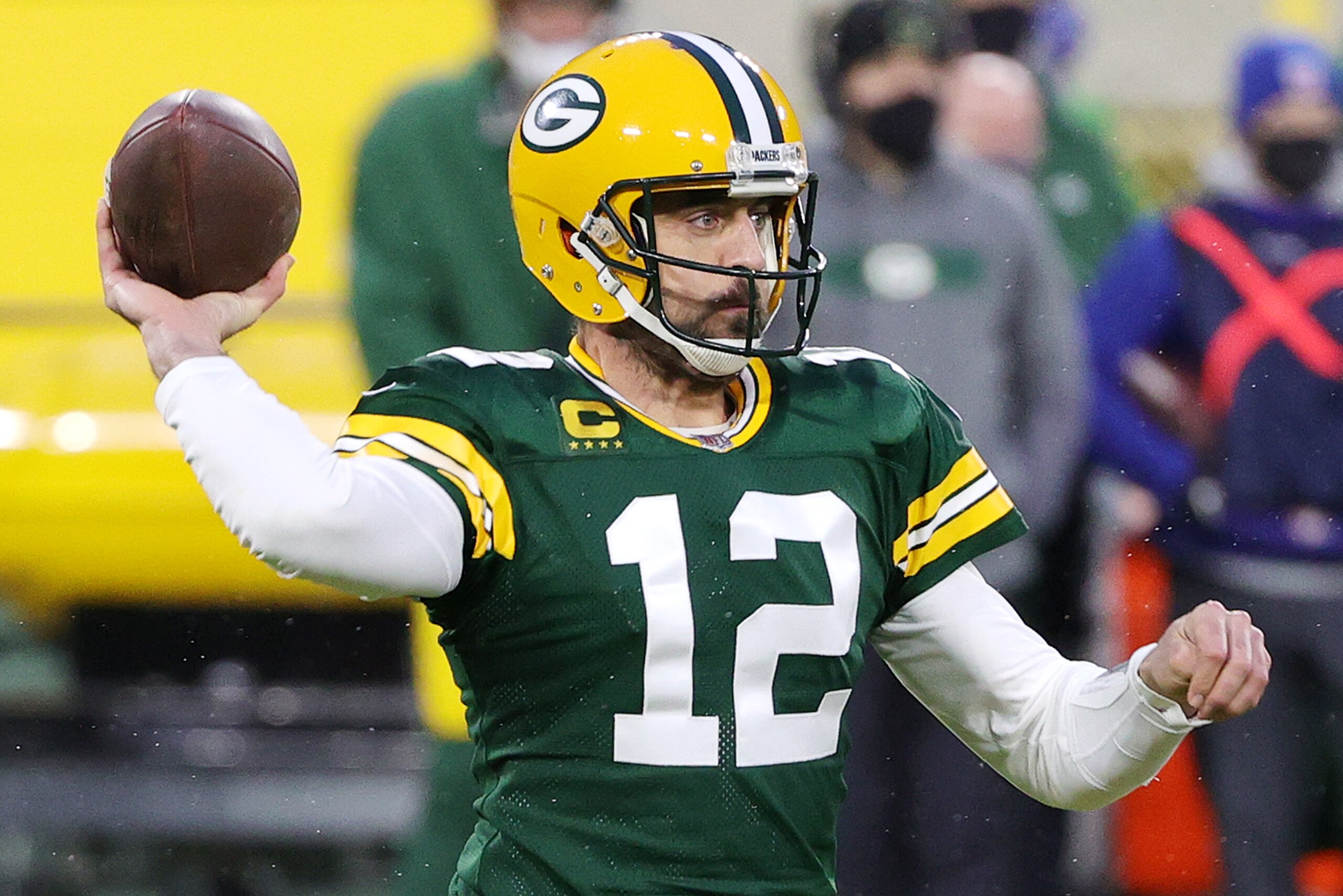GREEN BAY, WISCONSIN - JANUARY 16: Aaron Rodgers #12 of the Green Bay Packers throws a pass in the first half against the Los Angeles Rams during the NFC Divisional Playoff game at Lambeau Field on January 16, 2021 in Green Bay, Wisconsin. (Photo by Stacy Revere/Getty Images)