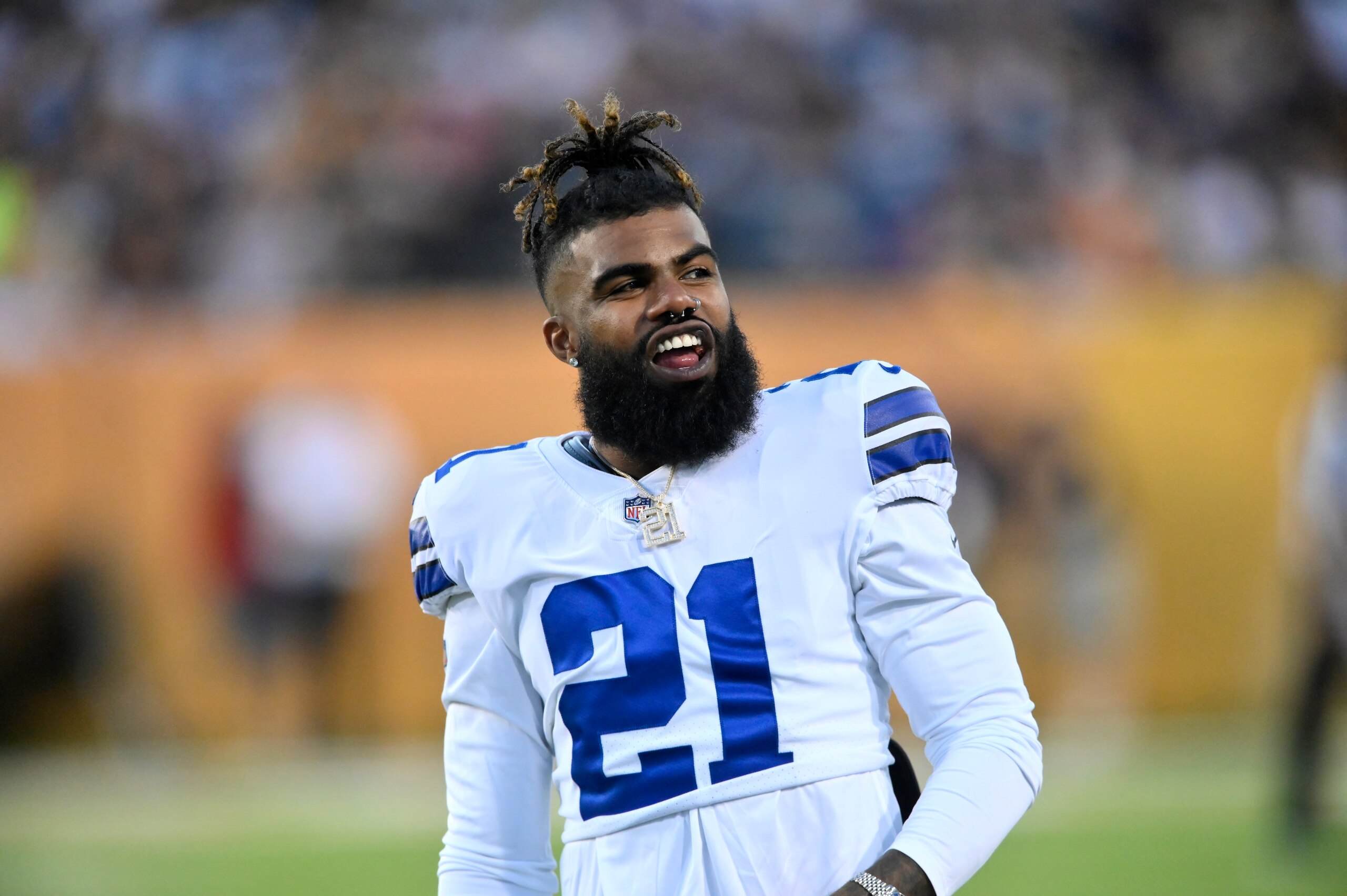 Dallas Cowboys running back Ezekiel Elliott (21) reacts in the first quarter of the Pro Football Hall of Fame NFL preseason game against the Pittsburgh Steelers, Thursday, Aug. 5, 2021, in Canton, Ohio. (AP Photo/David Richard)