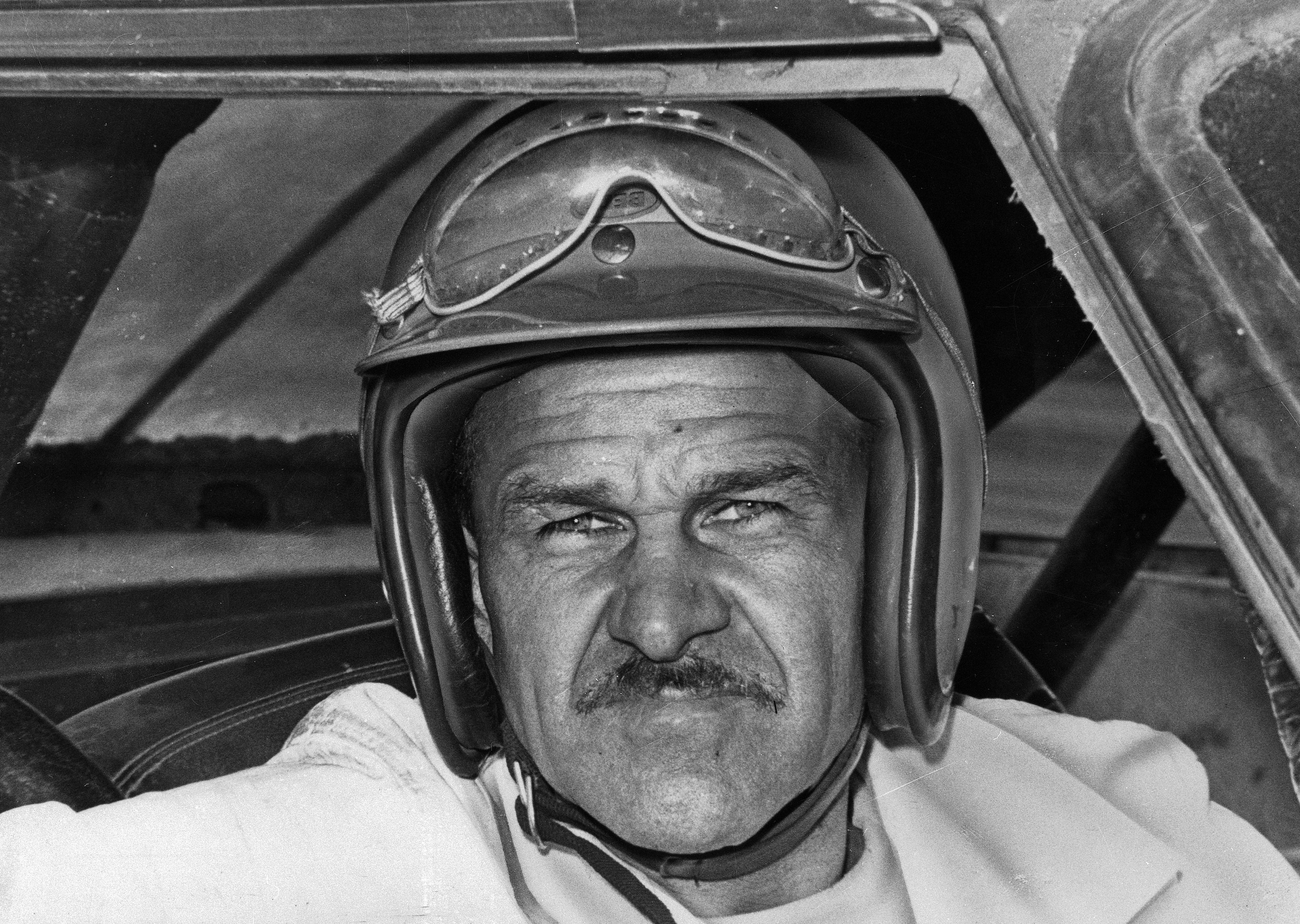 FILE - In this Aug. 1, 1969, file photo, Wendell Scott sits in a race car, location not known. Scott earned a second NASCAR first on Wednesday, May 21, 2014: He became the first African-American driver to be elected to the NASCAR Hall of Fame. The late driver from Virginia was among the latest group of five--all drivers, another first--voted in the hall on Wednesday. Scott joins popular NASCAR champion Bill Elliott, two-time series champ Joe Weatherly, 1960 champion Rex White and 26-time race winner Fred Lorenzen. (AP Photo/File)