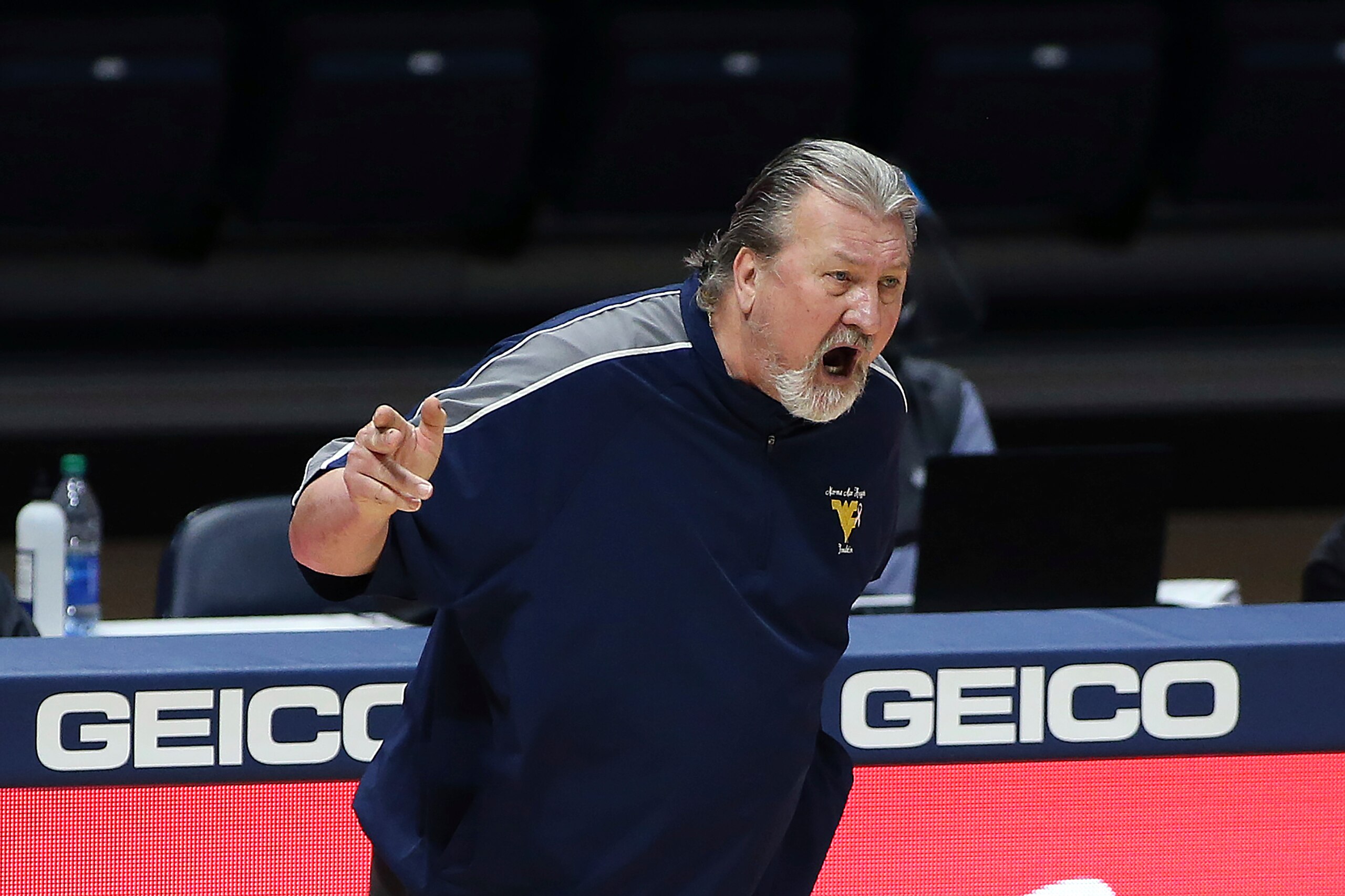 West Virginia coach Bob Huggins reacts during the second half of an NCAA college basketball game against Oklahoma State Saturday, March 6, 2021, in Morgantown, W.Va. (AP Photo/Kathleen Batten)