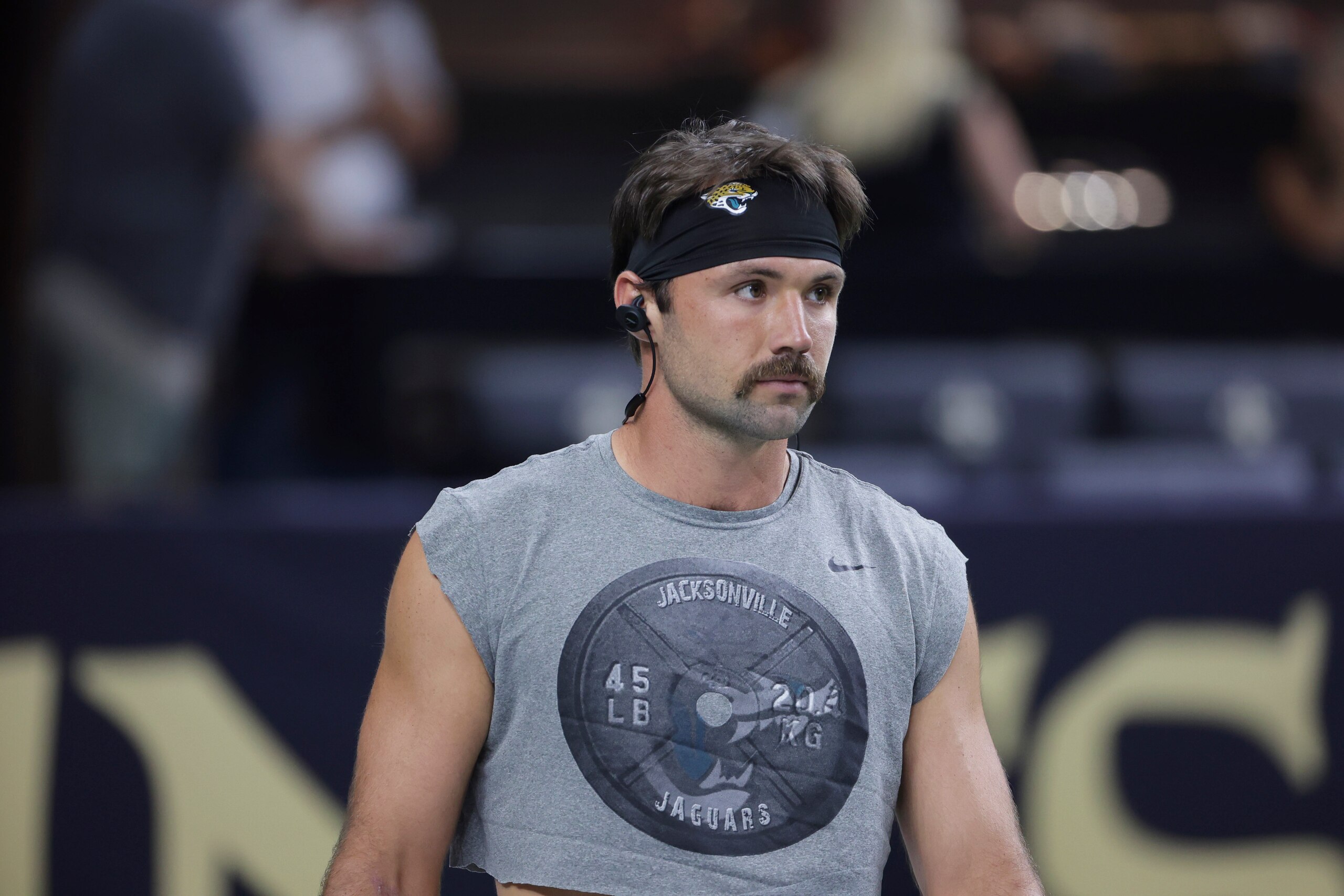 Jacksonville Jaguars quarterback Gardner Minshew walks on the field before an NFL preseason football game against the New Orleans Saints in New Orleans, Monday, Aug. 23, 2021. (AP Photo/Brett Duke)