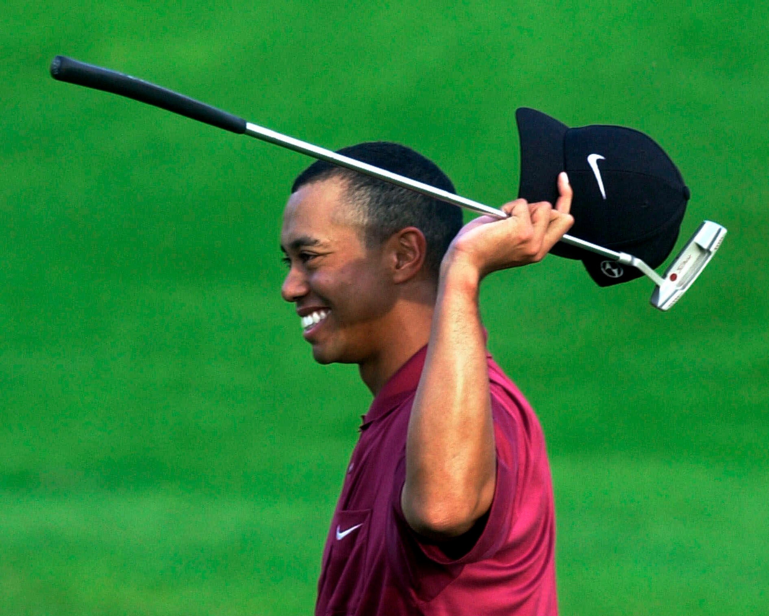FILE - In this April 8, 2001, file photo, Tiger Woods smiles after winning the Masters at Augusta National Golf Club in Augusta, Ga. It was 20 years ago this week that Woods became the first player to hold all four majors at the same time by winning the Masters. (AP Photo/Amy Sancetta, File)