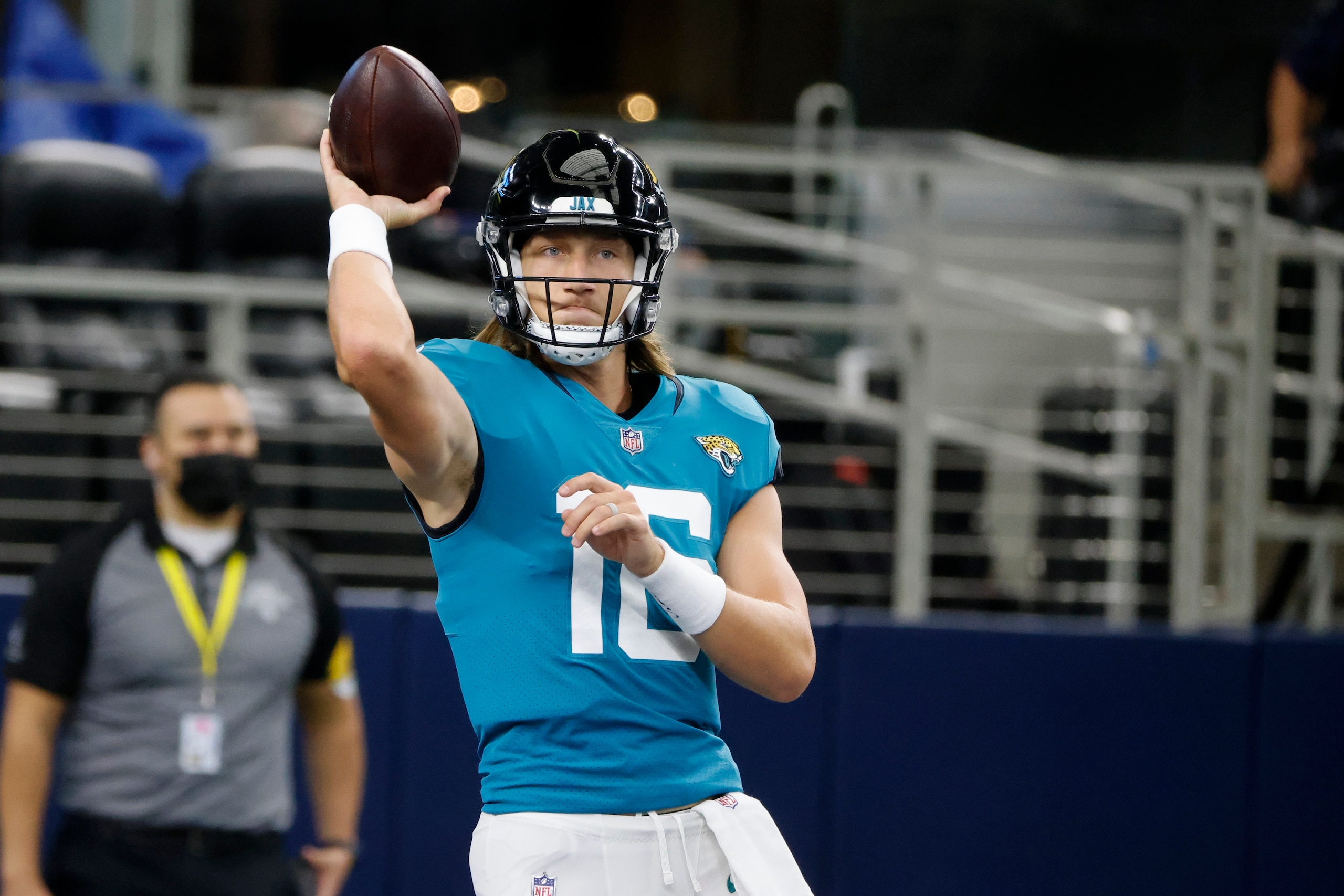 Jacksonville Jaguars quarterback Trevor Lawrence throws a pass during warmups before a preseason NFL football game against the Dallas Cowboys in Arlington, Texas, Sunday, Aug. 29, 2021. (AP Photo/Michael Ainsworth)
