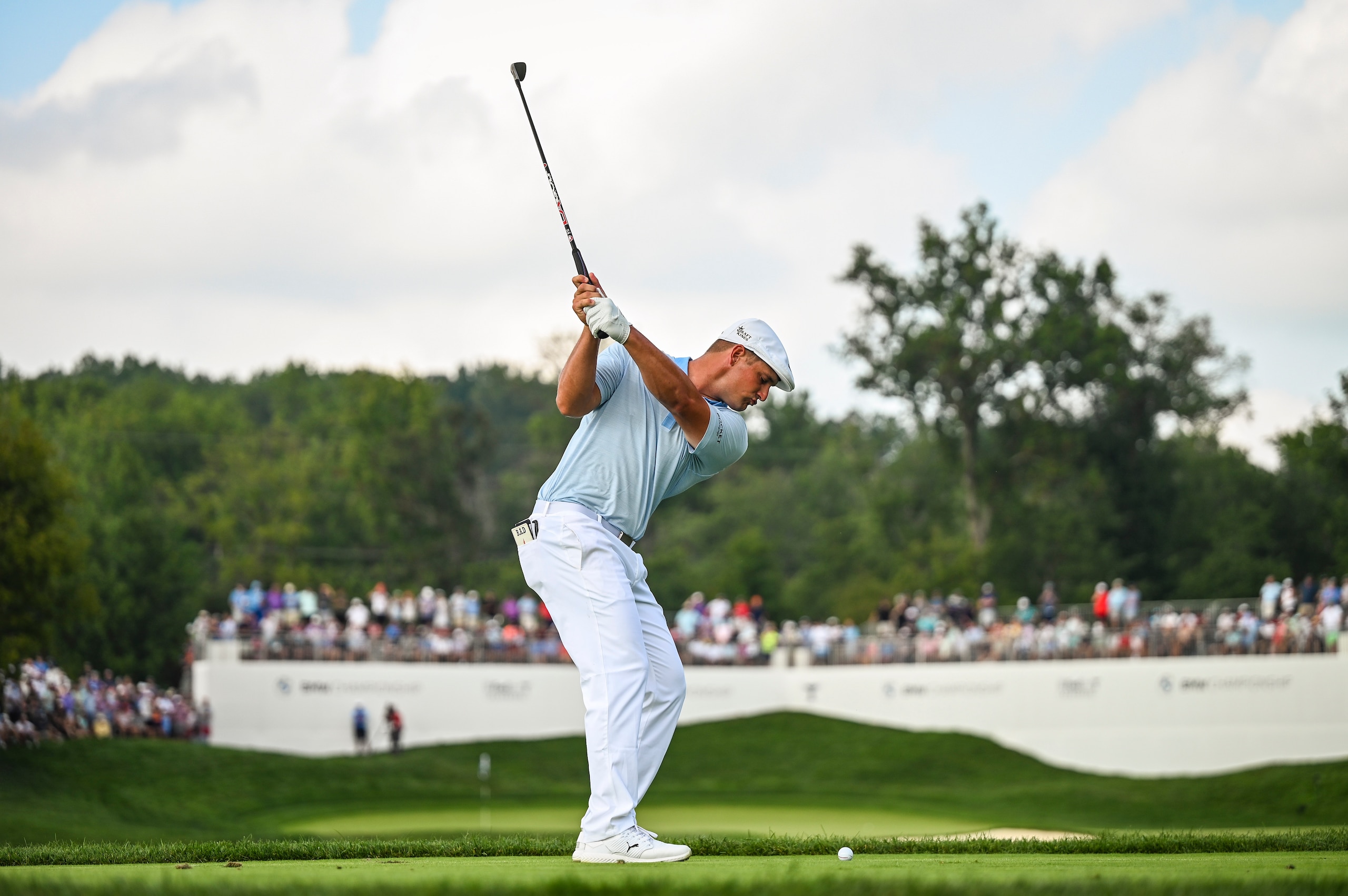 OWINGS MILLS, MD - AUGUST 28:  Bryson DeChambeau at the top of his swing as he plays his shot from the 13th hole drop zone after hitting his tee shot in the water during the third round of the BMW Championship, the second event of the FedExCup Playoffs, at Caves Valley Golf Club on August 28, 2021 in Owings Mills, Maryland. (Photo by Keyur Khamar/PGA TOUR via Getty Images)