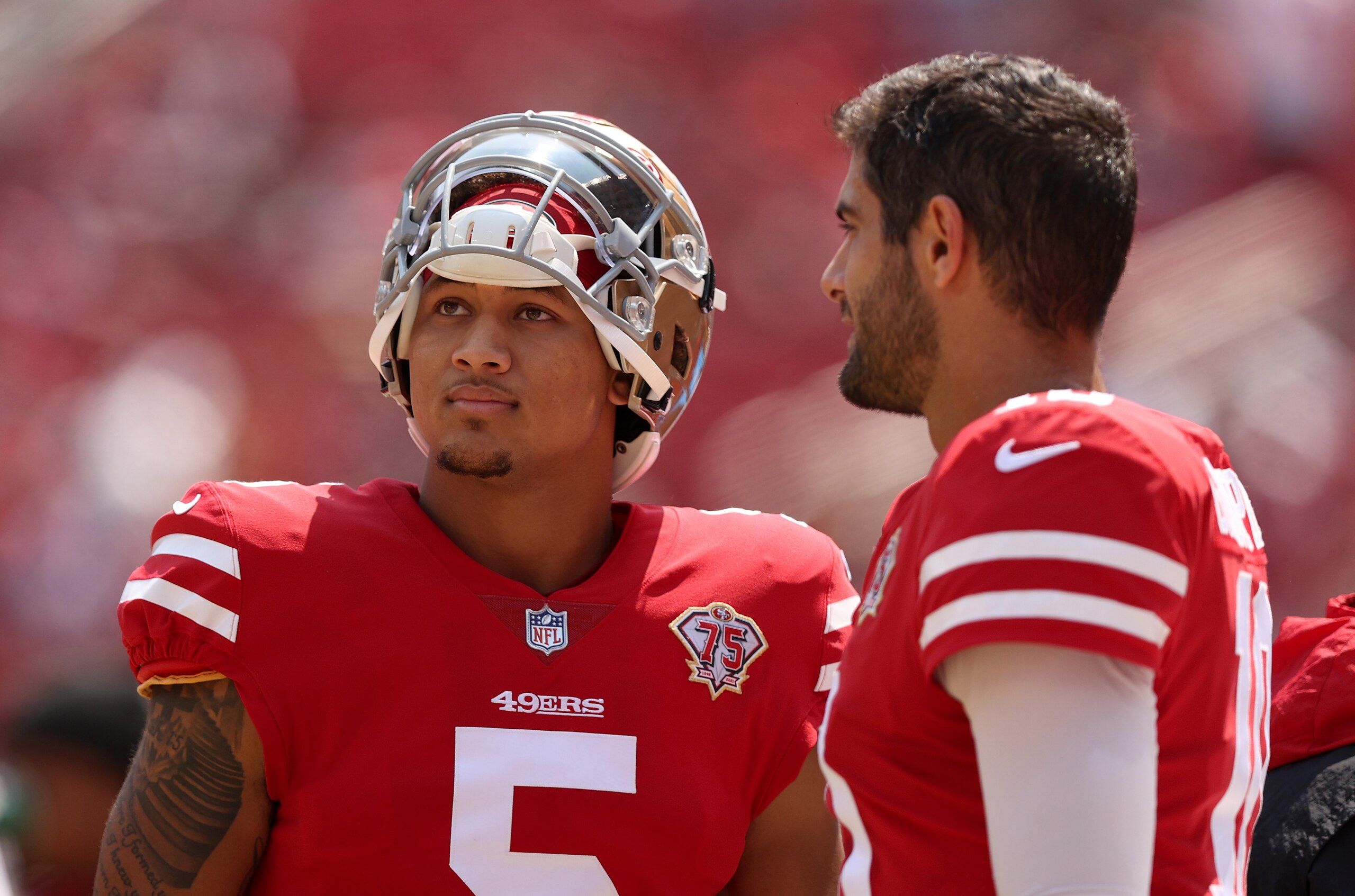 SANTA CLARA, CALIFORNIA - AUGUST 29: Jimmy Garoppolo #10 and Trey Lance #5 of the San Francisco 49ers talk to each other on the sidelines before their preseason game against the Las Vegas Raiders at Levi's Stadium on August 29, 2021 in Santa Clara, California. (Photo by Ezra Shaw/Getty Images) SANTA CLARA, CALIFORNIA - AUGUST 29: Jimmy Garoppolo #10 and Trey Lance #5 of the San Francisco 49ers talk to each other on the sidelines before their preseason game against the Las Vegas Raiders at Levi's Stadium on August 29, 2021 in Santa Clara, California. (Photo by Ezra Shaw/Getty Images)