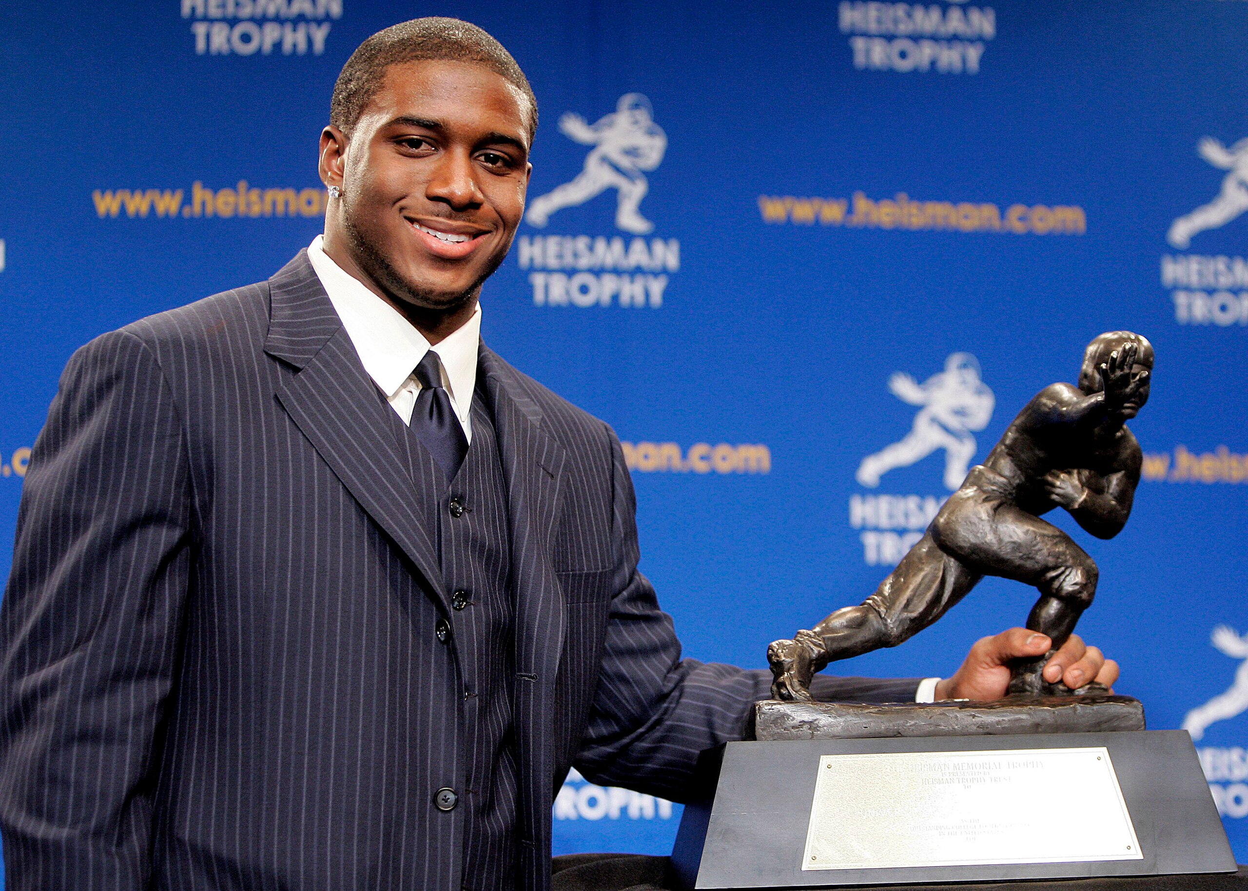 NEW YORK - DECEMBER 10: Running back Reggie Bush #5 of the USC Trojans poses with the 2005 Heisman trophy after winning the award at the 71st Annual Heisman Ceremony on December 10, 2005 in New York City. (Photo by Stephen Chernin/Getty Images) NEW YORK - DECEMBER 10: Running back Reggie Bush #5 of the USC Trojans poses with the 2005 Heisman trophy after winning the award at the 71st Annual Heisman Ceremony on December 10, 2005 in New York City. (Photo by Stephen Chernin/Getty Images)