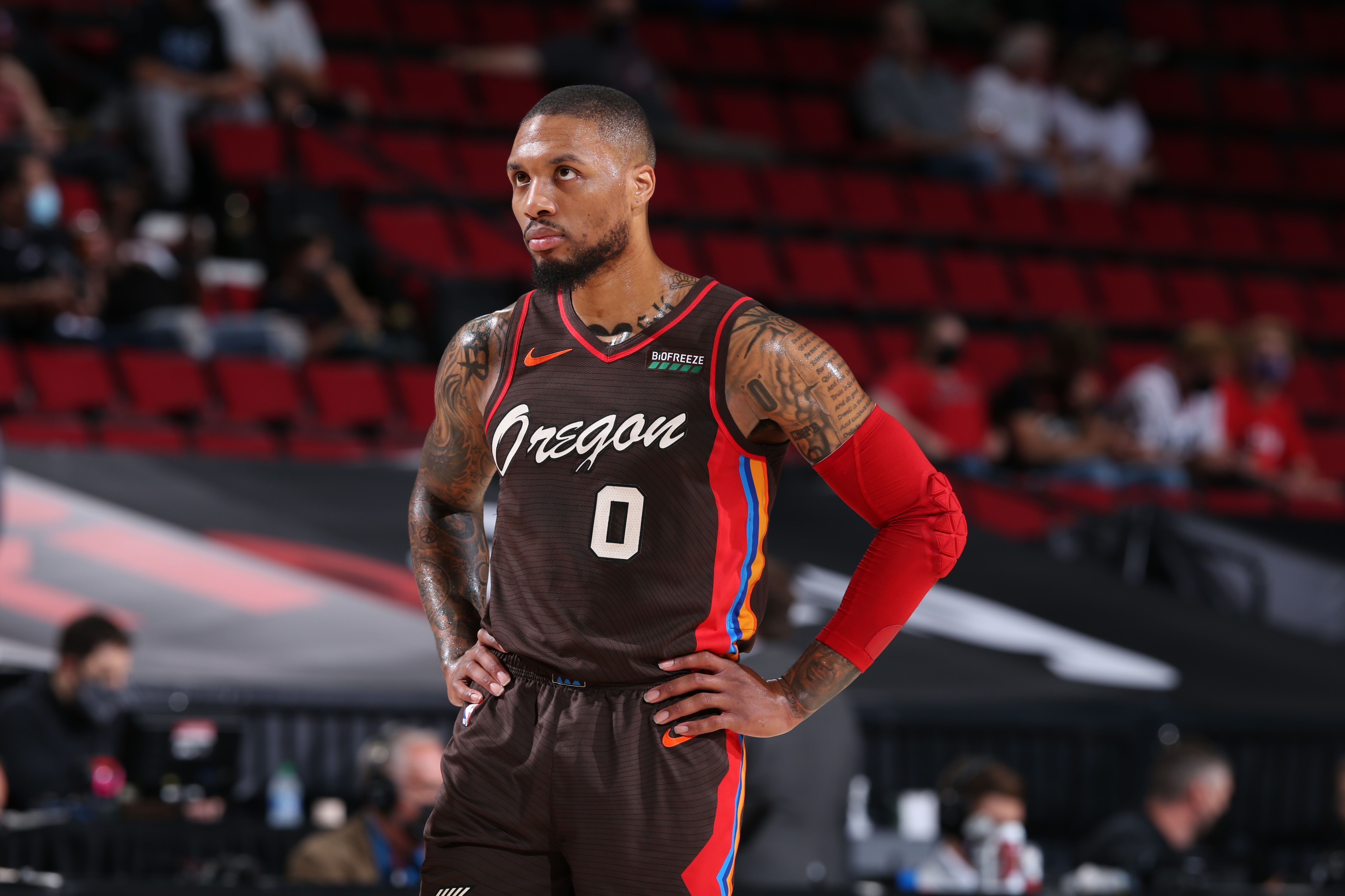 PORTLAND, OR - JUNE 3: Damian Lillard #0 of the Portland Trail Blazers looks on during the game against the Denver Nuggets on June 3, 2021 at the Moda Center Arena in Portland, Oregon. NOTE TO USER: User expressly acknowledges and agrees that, by downloading and or using this photograph, user is consenting to the terms and conditions of the Getty Images License Agreement. Mandatory Copyright Notice: Copyright 2021 NBAE (Photo by Sam Forencich/NBAE via Getty Images)
